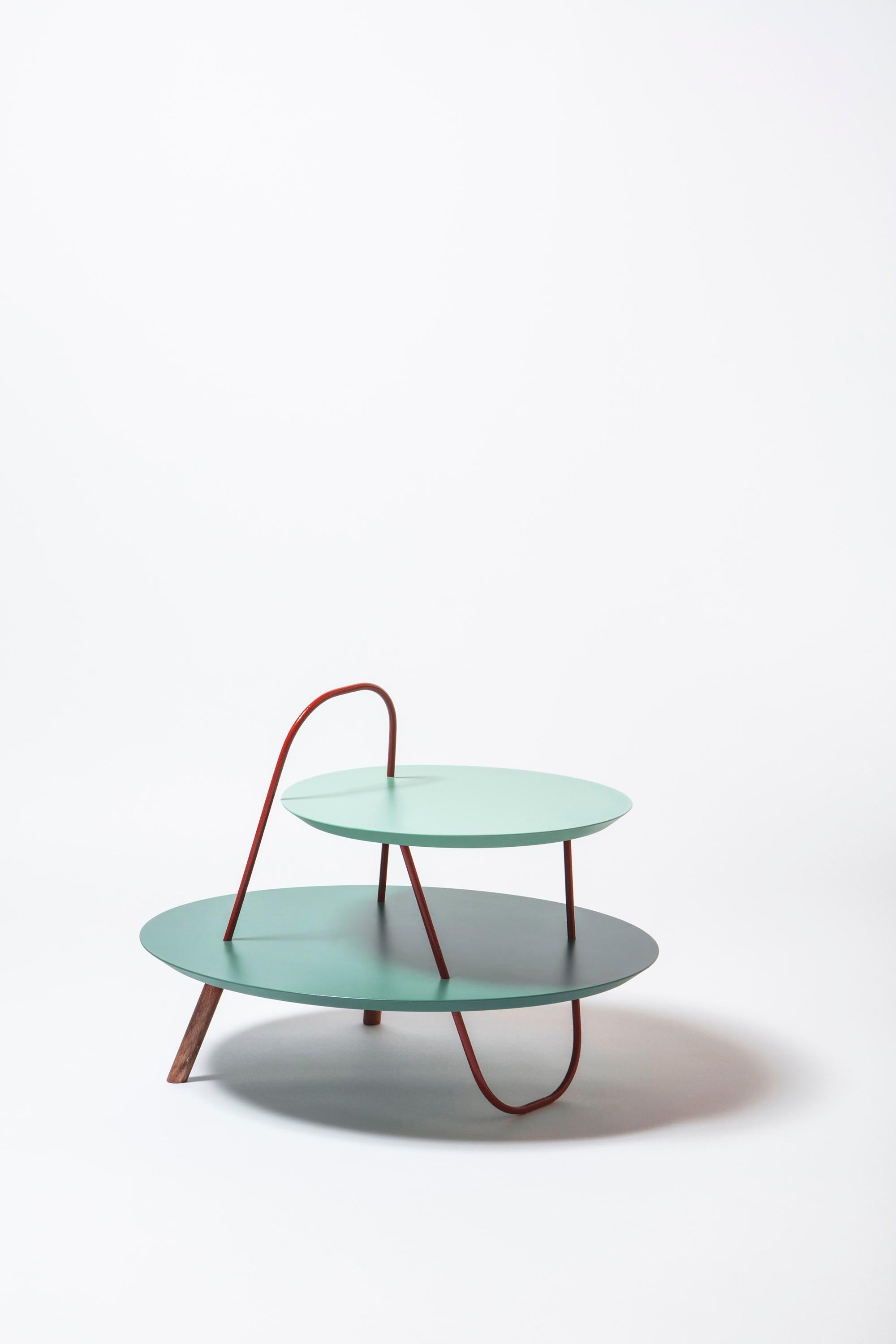 As free trajectories in space, metal structures create winding geometries. ORBIT is a family of tables with a unique image. Curved tubulars cross - on several levels – with circular or elliptical wooden tops.
Design by Accardi Buccheri for