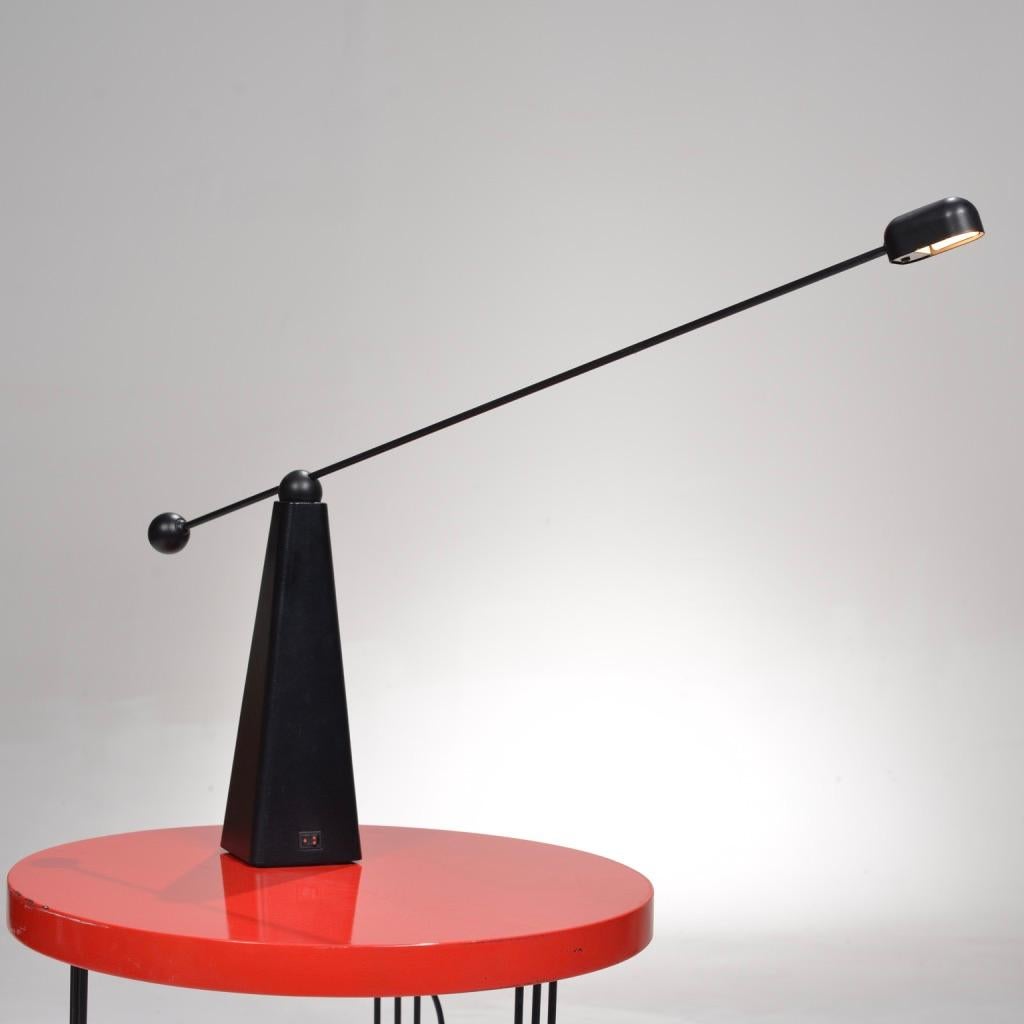 This is the orbit table lamp designed by Ron Rezek for Bieffeplast, circa 1980. Beautiful Postmodern design featuring an adjustable swivel neck and triangular base.  We currently have 3 in stock.  Price is per lamp.  