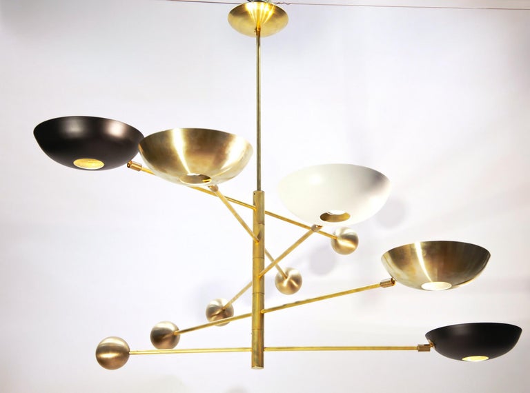 Sculptural bespoke brass chandelier. Shown with 5 rotating arms. 

Compact version, a great chandelier for low ceilings. Chandelier has a minimal height of 70 cm/ 28 inches and will work with low ceiling. 

Arms are balanced with a heavy cast