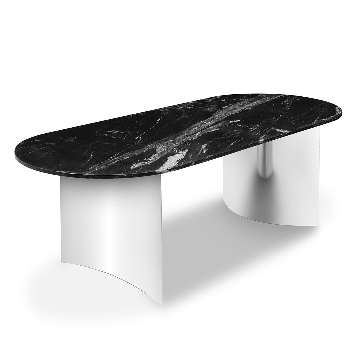 Table Orcante with chromed feet
and with black marble top.