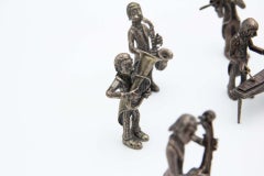 Orchestra of (15) musicians in silver with conductor