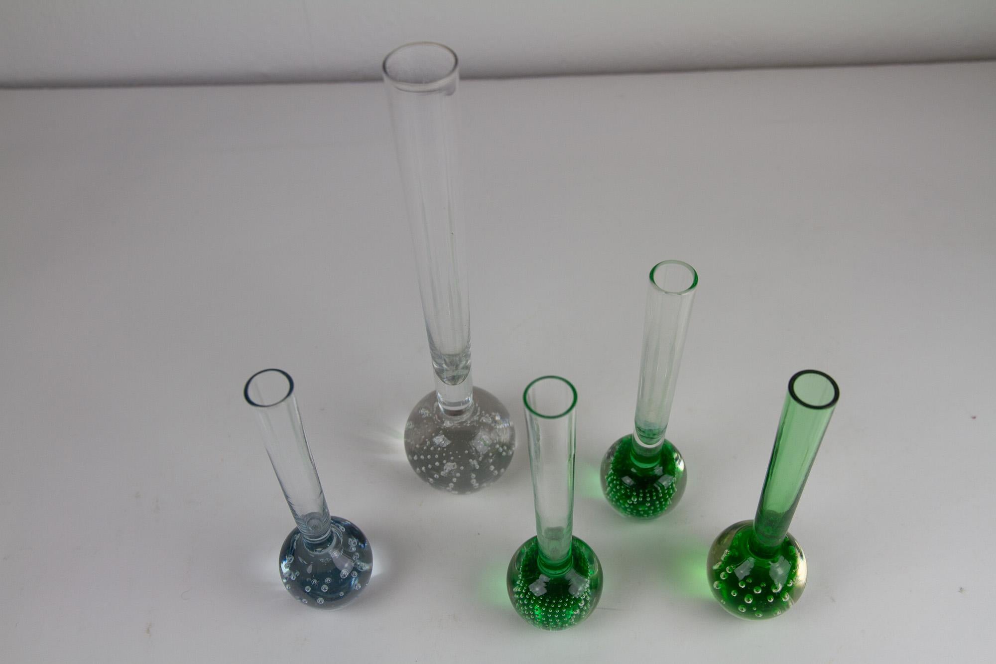 Orchid Bubble vases by Per Lütken for Holmegaard 1950s, Set 5.
These five vintage Danish bubble orchid vases in green and clear glass were designed by Per Lütken for Holmegaard in Denmark in the 1950s. There are all made by hand and the bubble
