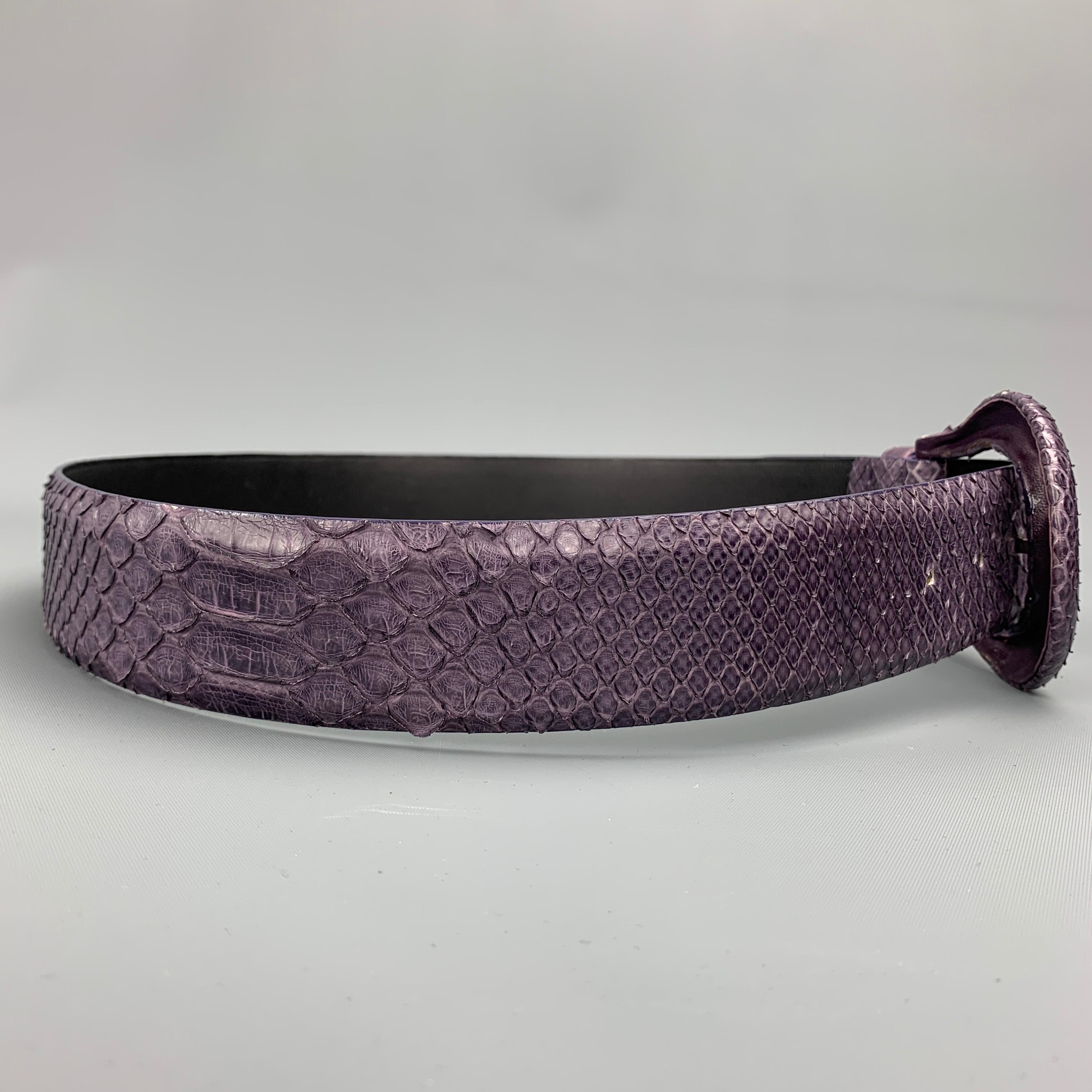 ORCIANI belt comes in a purple snake skin leather featuring a covered buckle. Made in Italy. 

Very Good Pre-Owned Condition.
Marked: 75

Length: 37 in.
Width: 1.5 in.
Fits: 28 in. - 32 in.
Buckle: 2 in.  

SKU: 98511
Category: Belt

More