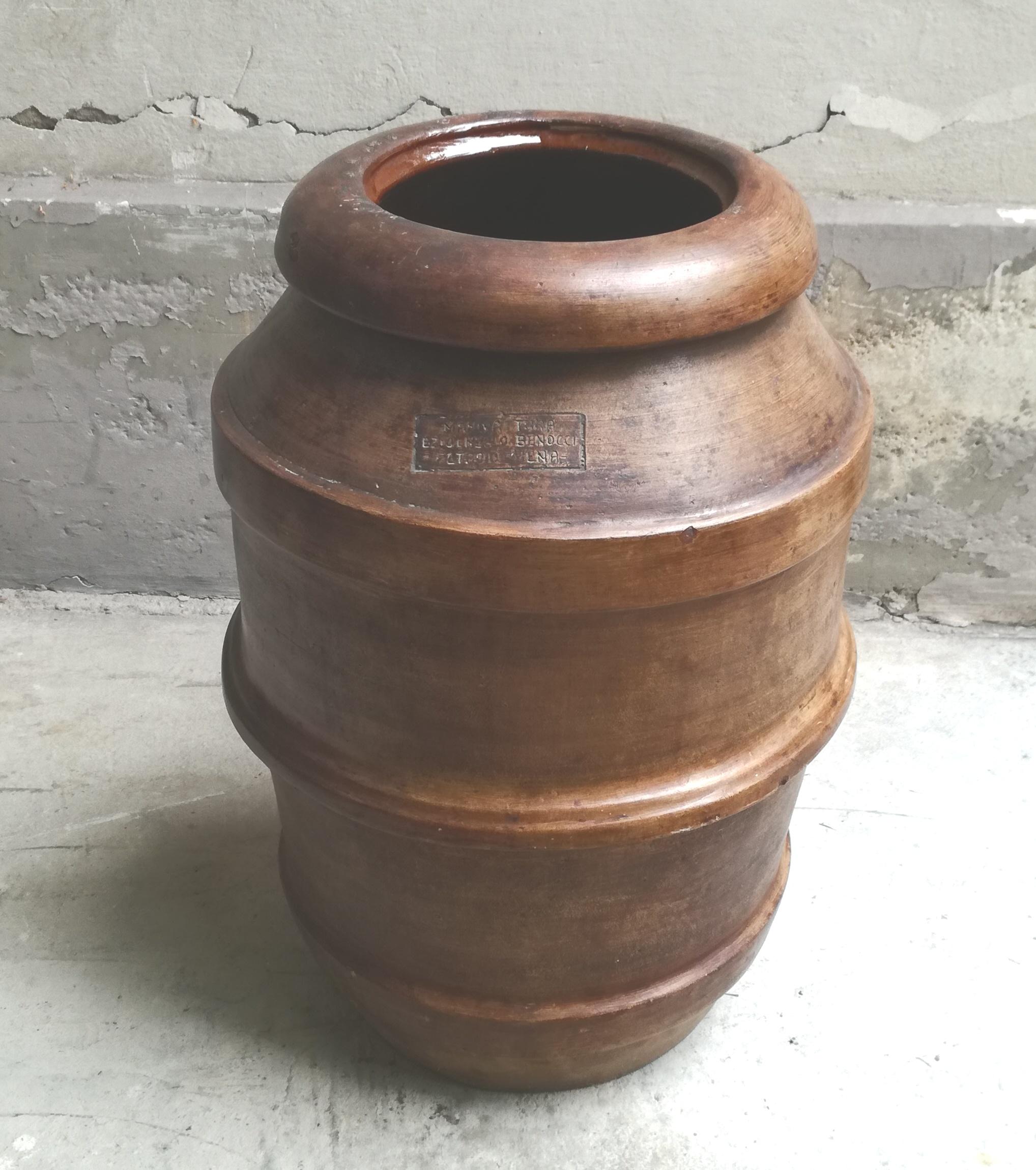 olive oil jar. ,use vase / tuscan terracotta umbrella stand, 1940s. made entirely of handmade and kiln-fired terracotta. frost-proof and very durable. can be used as an umbrella stand, but also as a vase stand. it is thick and heavy c.a 20 kg