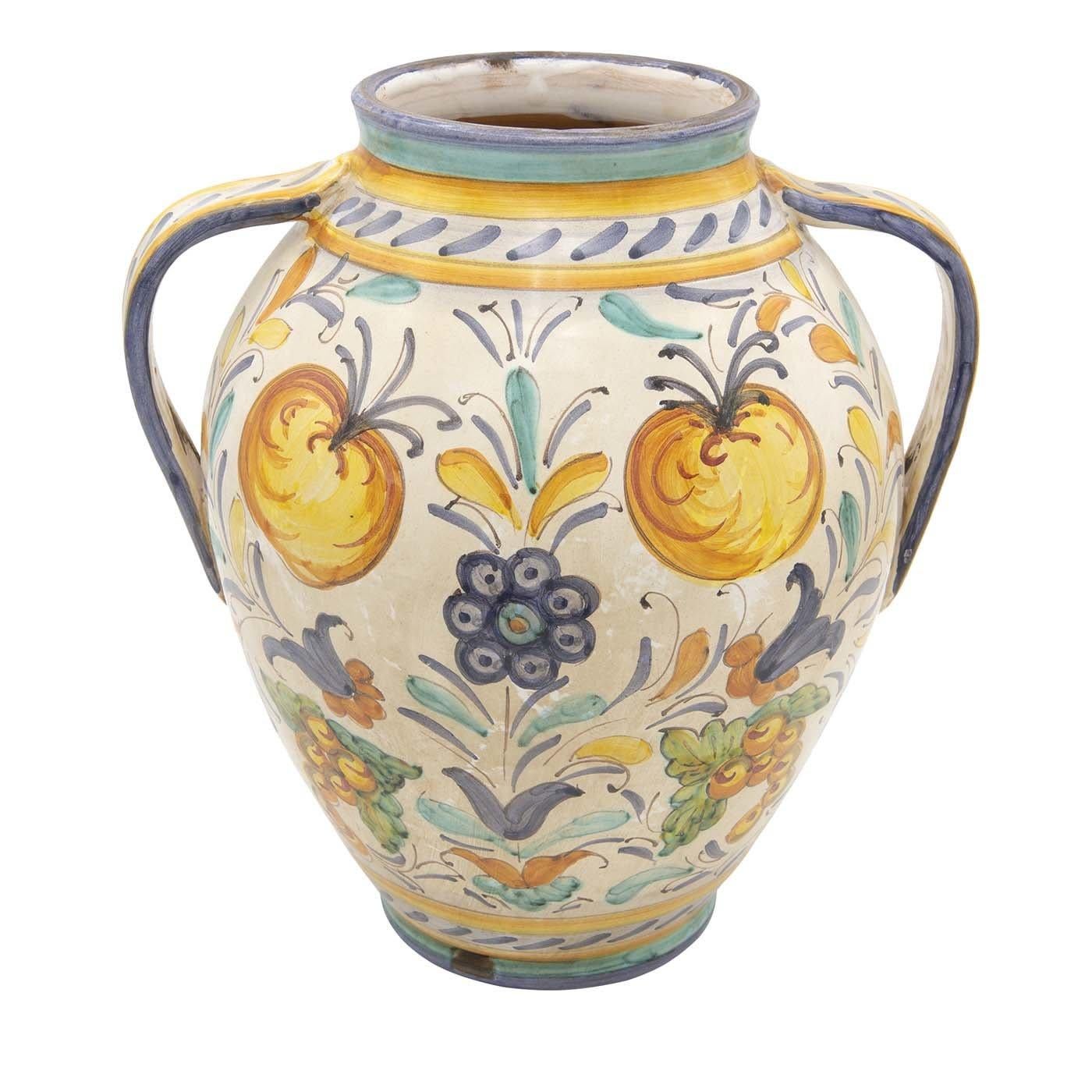 A stunning objet d'art, this vase was entirely crafted by hand of ceramic by master artisan Lorenza Adami. Expression of the iconic tradition of Renaissance pottery, this vase showcases delicate curves, two handles, and a superb hand-applied