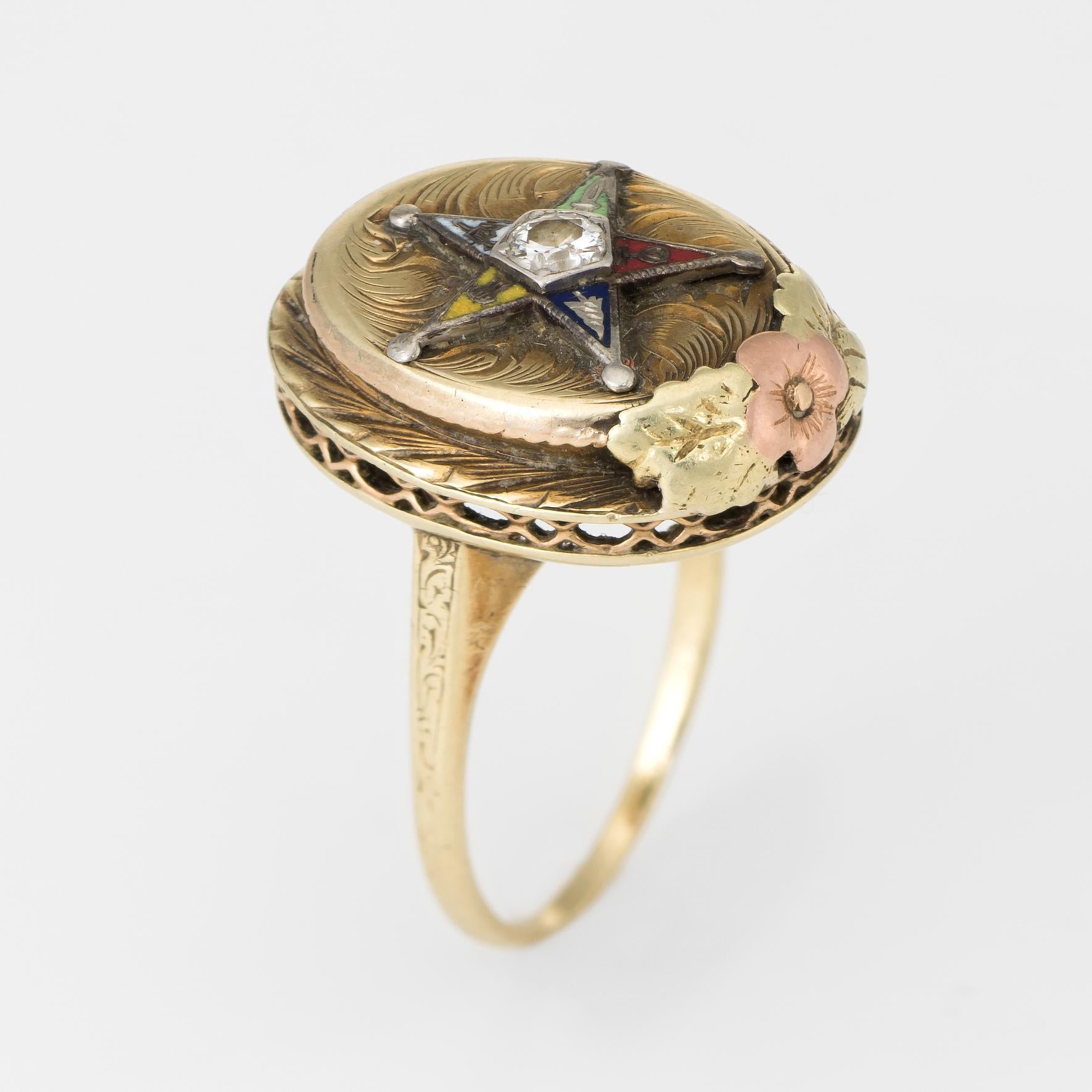 Finely detailed vintage Order of the Eastern Star ring, crafted in 14 karat yellow gold. 

Centrally mounted estimated 0.15 carat old European cut diamond (estimated at I-J color and I1 clarity).   Red, blue, yellow, white and green enamel frames