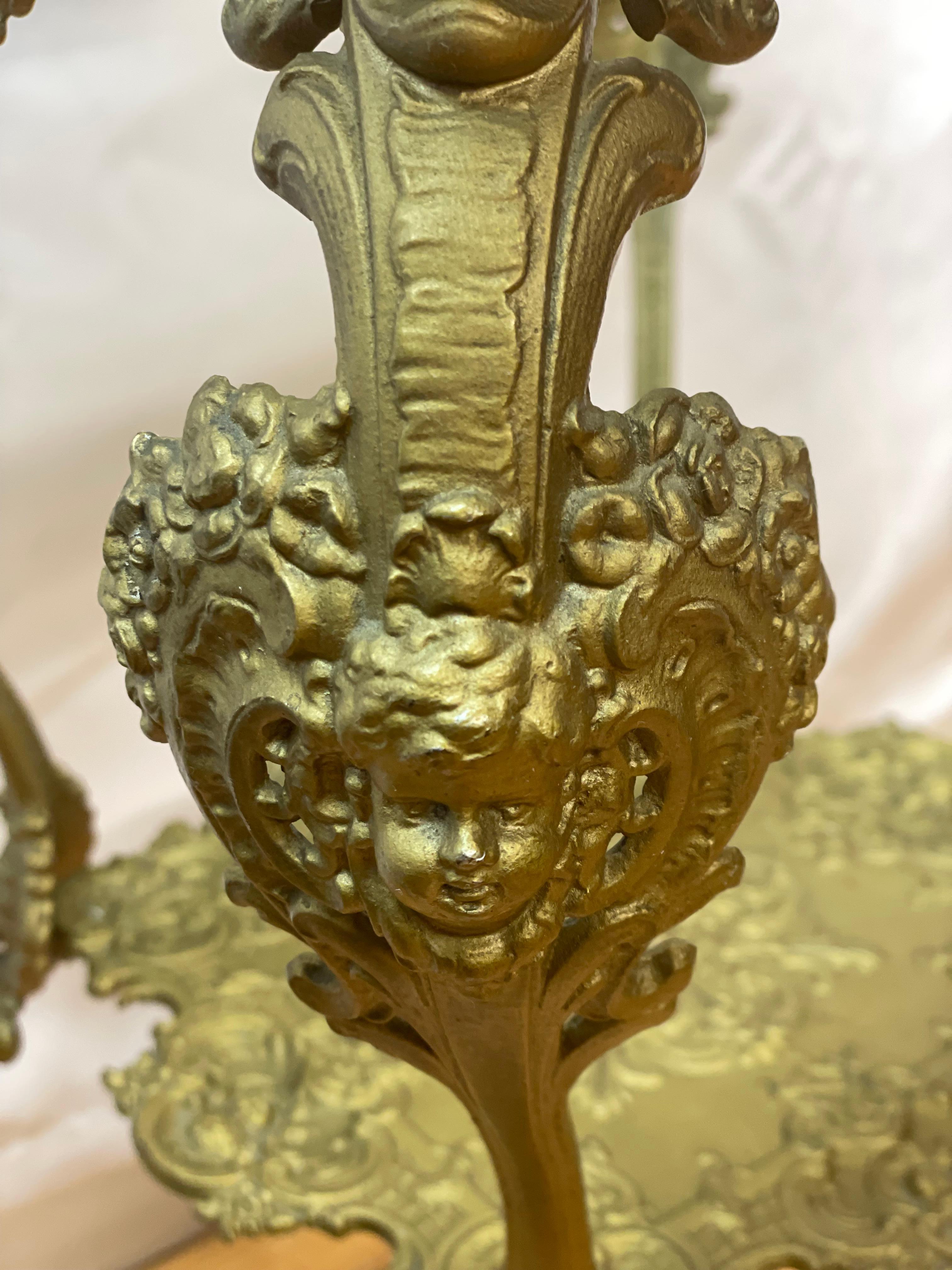 Ornate 1920's Two-Tier Brass Table w/Glass Top decorated with cherubs  For Sale 2