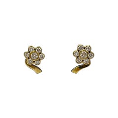 Orecchini artigianali a fiori in oro giallo 18 kt con diamanti