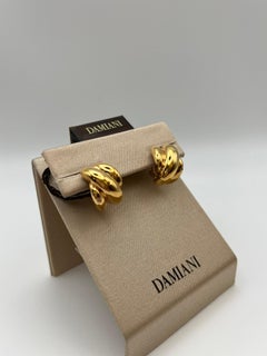 Orecchini Damiani gomitolo in oro 18 kt. con diamanti - Iconico design italiano