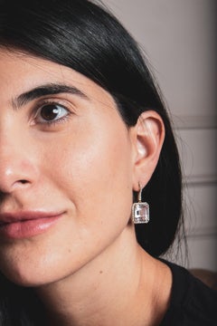 Handmade 18-karat gold earrings with vivid kunzite and diamonds in a halo hook setting