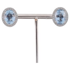 Orecchini in oro bianco con Diamanti e Topazi