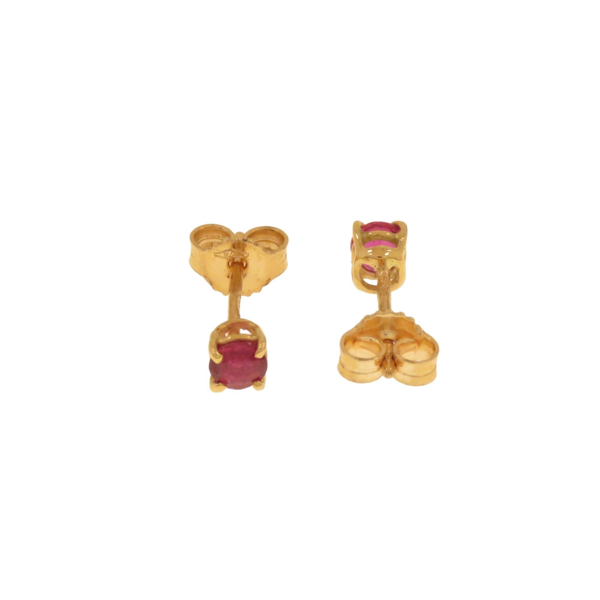 Minimal earrings made by Botta Gioielli in Milan in 9k rose gold with two 4 mm / 0.157 inches brilliant-cut rubies totaling 0.40 ct. The stones are set in a jaw bezel with gallery. The earrings have a butterfly clasp. The total weight of the