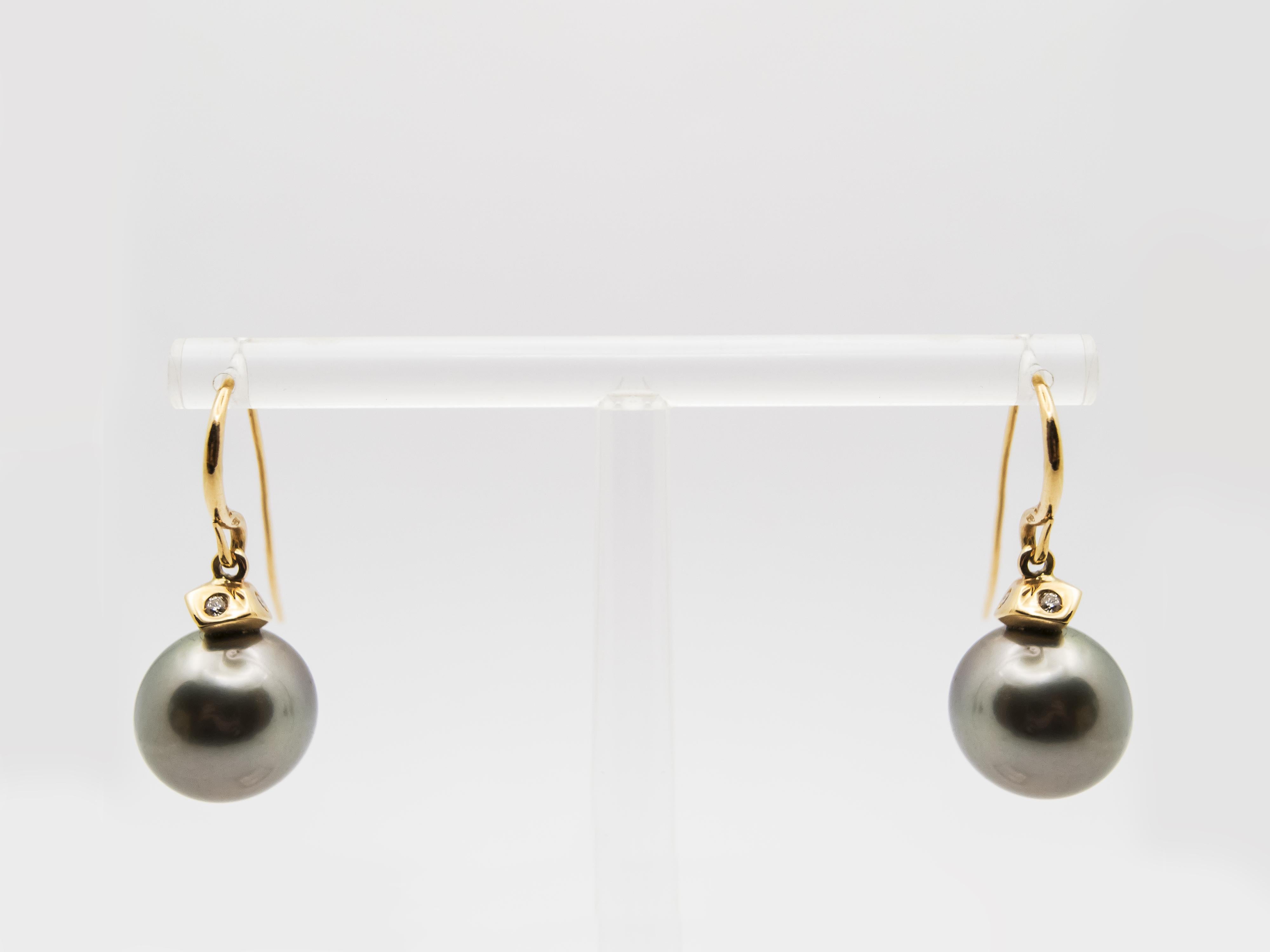 A pair of precious earrings with elegant and contemporary style.
Their design is enhanced by Tahitian pearls that have a magnificent balanced gray color and are at the same time very bright 
The diameter of the pearls is 12.8 mm and they have a