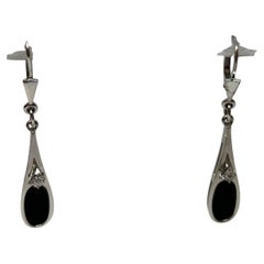 Antique 9 kt white gold earrings with onyx and diamond