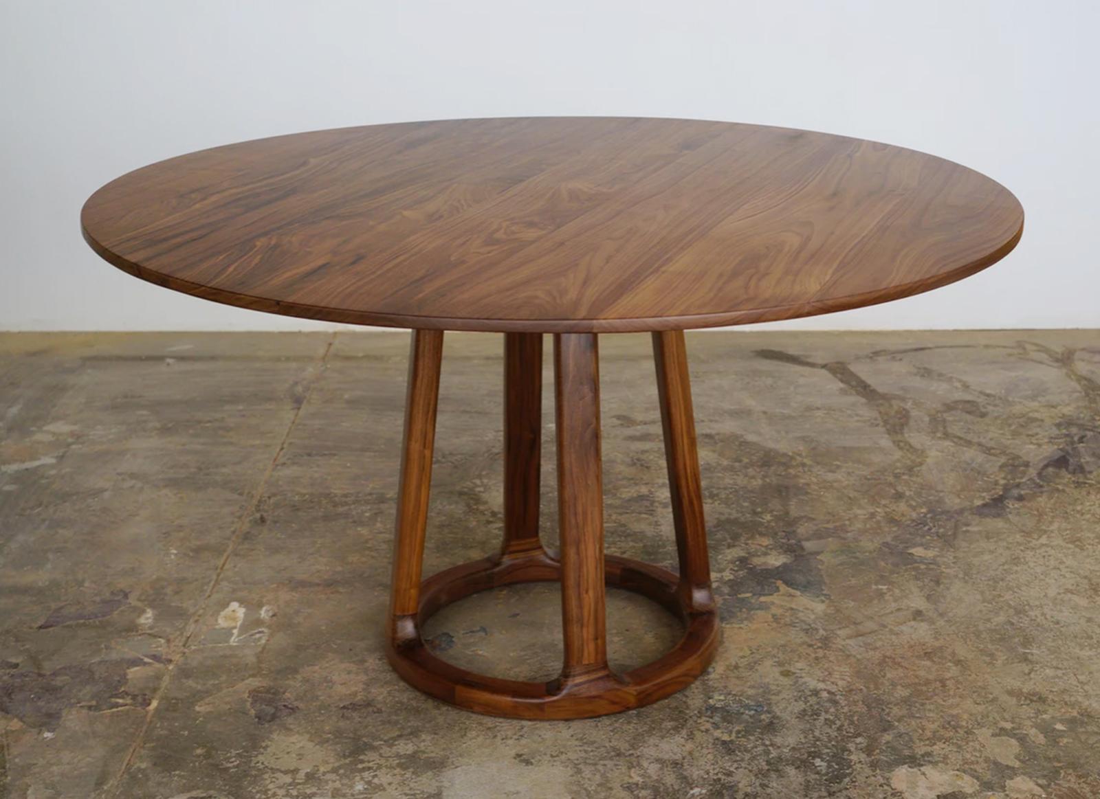 The Orenn table in walnut wood. Each piece of wood is hand-selected for color, grain and then meticulously matched to ensure a beautiful natural flow. Traditional Japanese joinery is used to connect each piece of wood, thus ensuring its structural