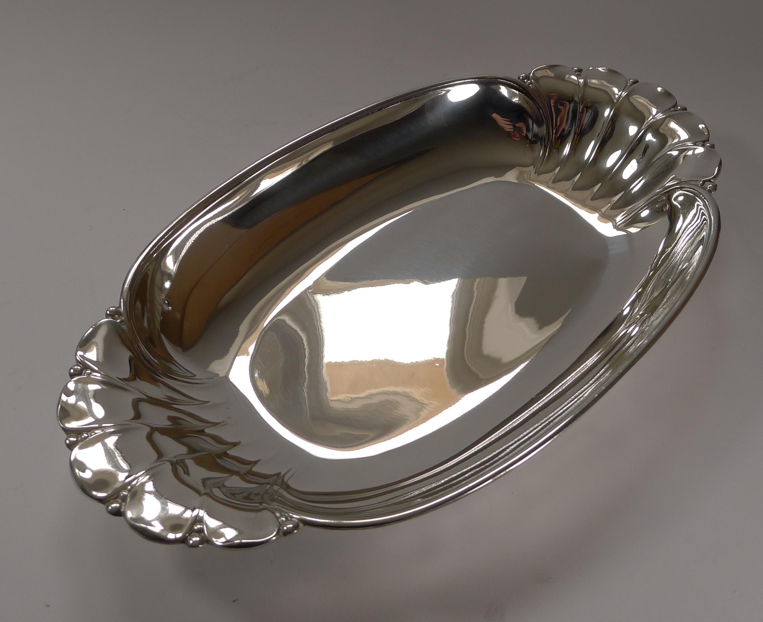 A magnificent and truly stylish bread basket made from silver plate by the world famous Maison Christofle, part of the Gallia range. The underside is fully marked with the famous Orfèvrerie Gallia mark, this particular example used between 1900 and