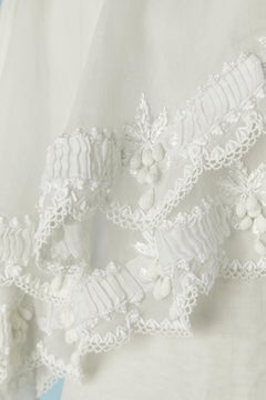 Organdy wedding dress with asymmetrical cape with embroideries Circa 1960's/70's