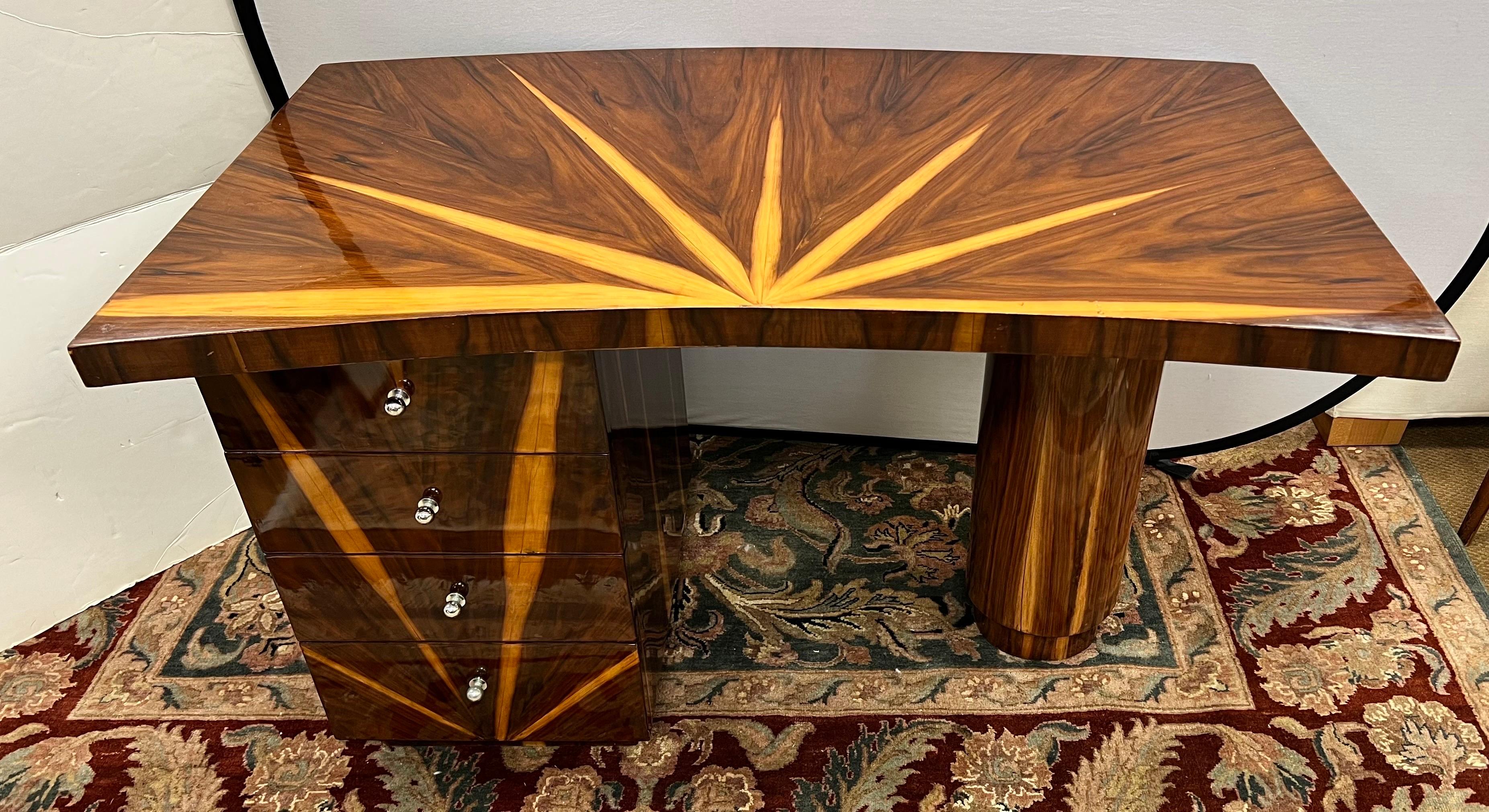 Sculptural 20th century Art Deco curved desk/writing table. Supported by set of drawers at left and a lone pillar at right. Great lines and better scale. All wood with veneer and great colors, see pics for best detail.