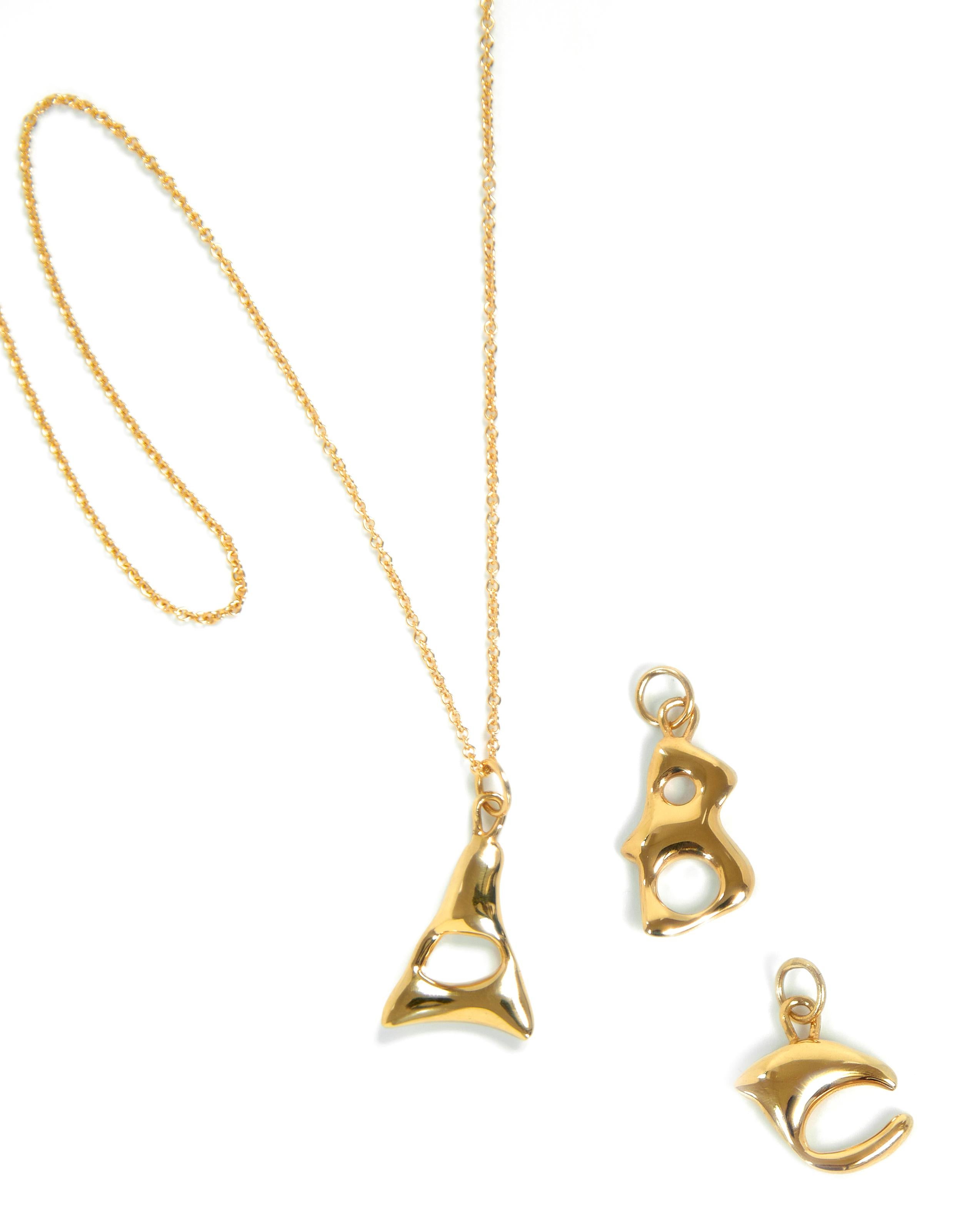 BAR Jewellery, London UK, ALPHABET NECKLACE, Gold Plated 

Our Alphabet necklaces were designed by hand 'writing' each individual letter using molten wax that is then cast in solid silver. Inspiration for the fluid, tactile letter shapes comes from
