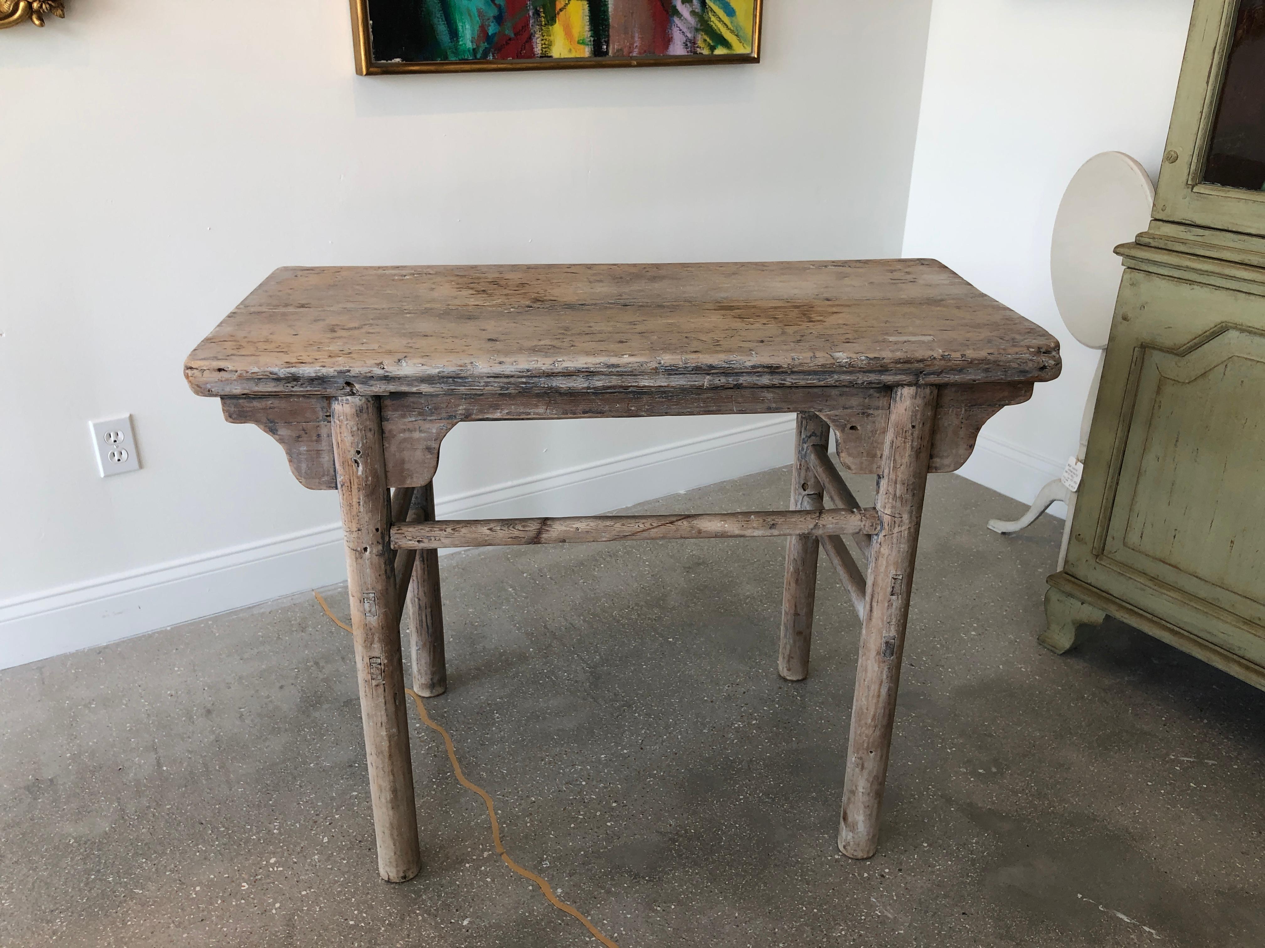 Organic antique Asian console table in bleached poplar wood
Has a lovely distressed patina for the wood and years of use,
can be a console or small sideboard, circa 1820-1830

Measures: H 31