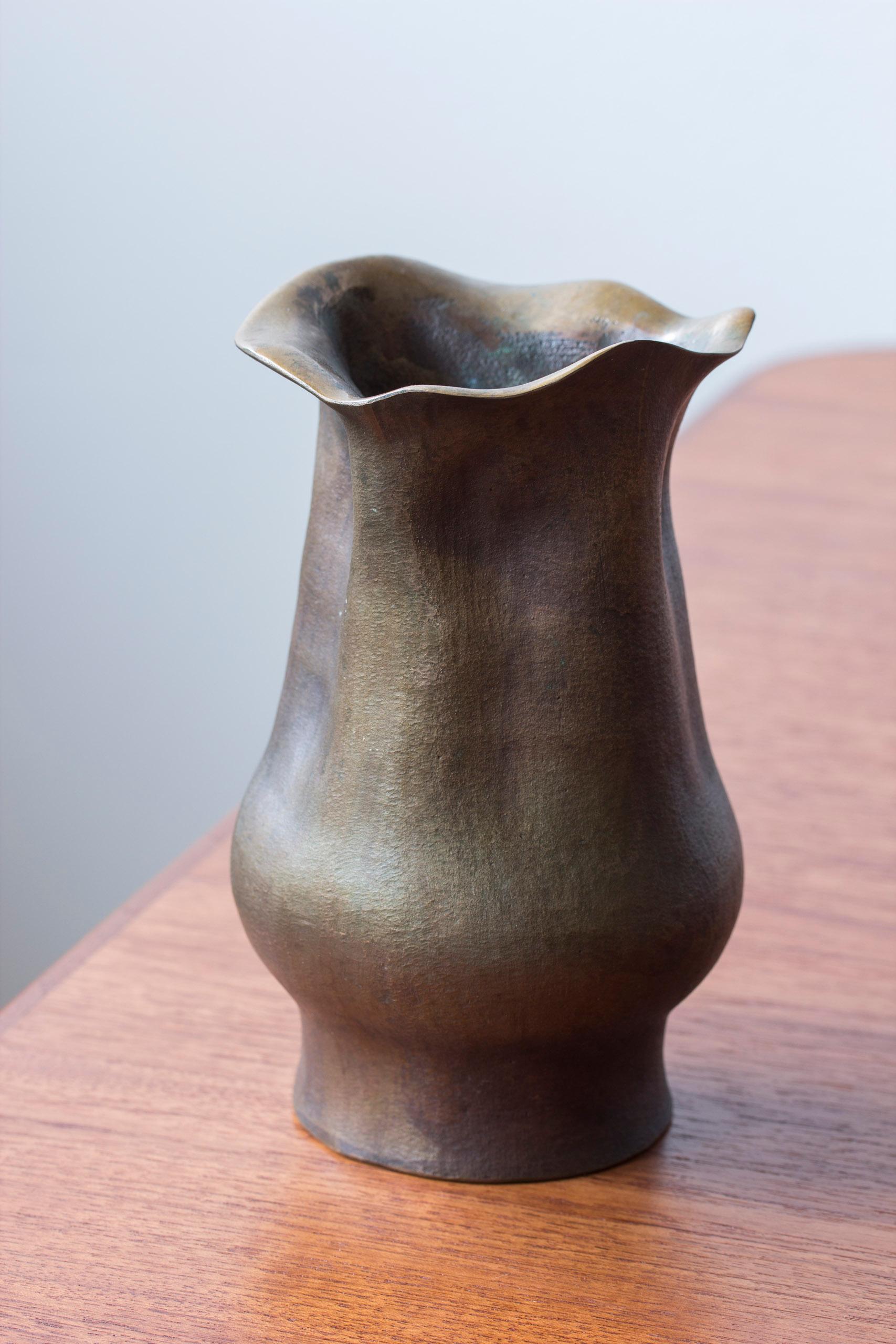 Exceptional organic bronze vase produced in Sweden by Ekbergs ca 1950-60s. Very heavy and well made cast with a slightly oxidized patina. Functional piece that works just as well on its own as an art object. Very good vintage condition with light