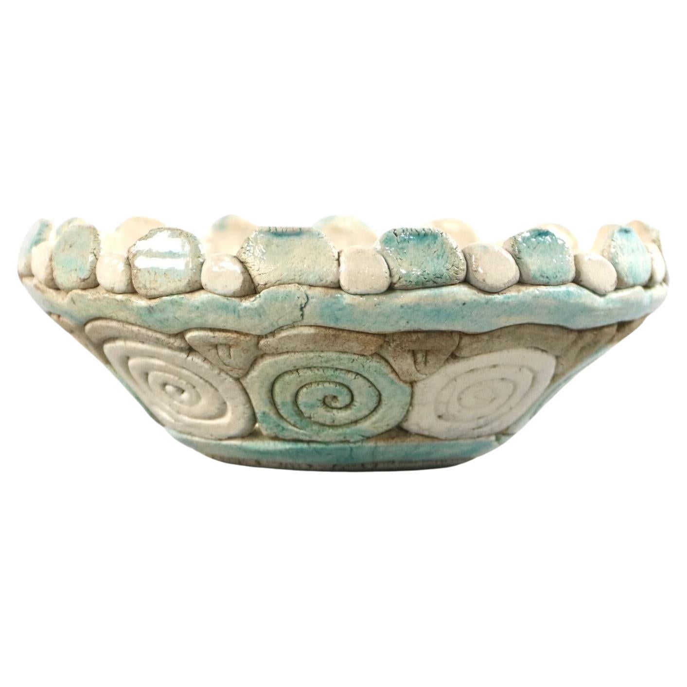 Unique organic art bowl. Raw form with a natural effect and turquoise-white color from around 1970. The mosaic-like surface is simple, yet inexhaustibly varied, and naturally exudes an atmosphere of artisanal precision and unrepeatability. The