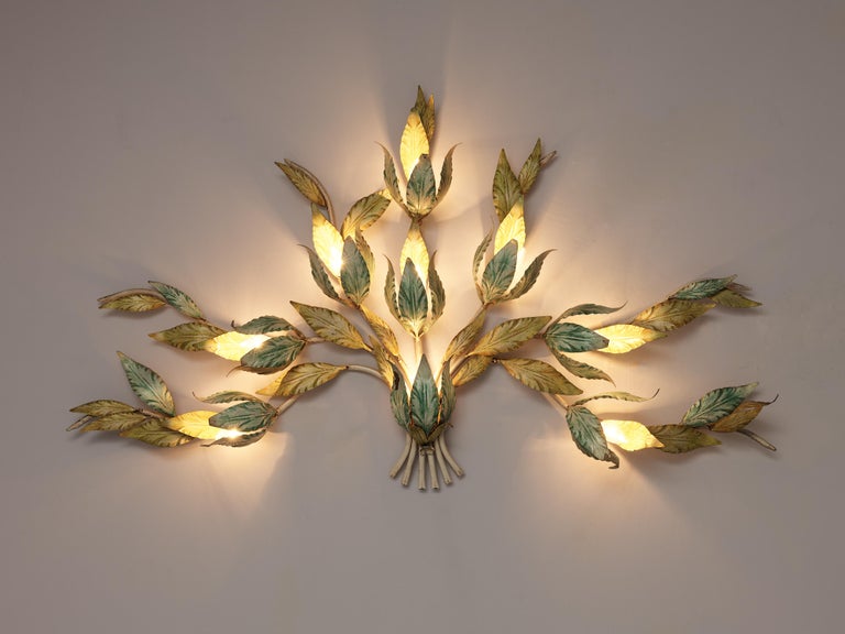 Wall lamps, painted metal, Italy, 1970s

Highly decorative, organic wall lamp that resembles branches of a plant. The branches feature leaves in the colors of light green and yellow. They hide the lightbulbs that create a wonderful indirect light