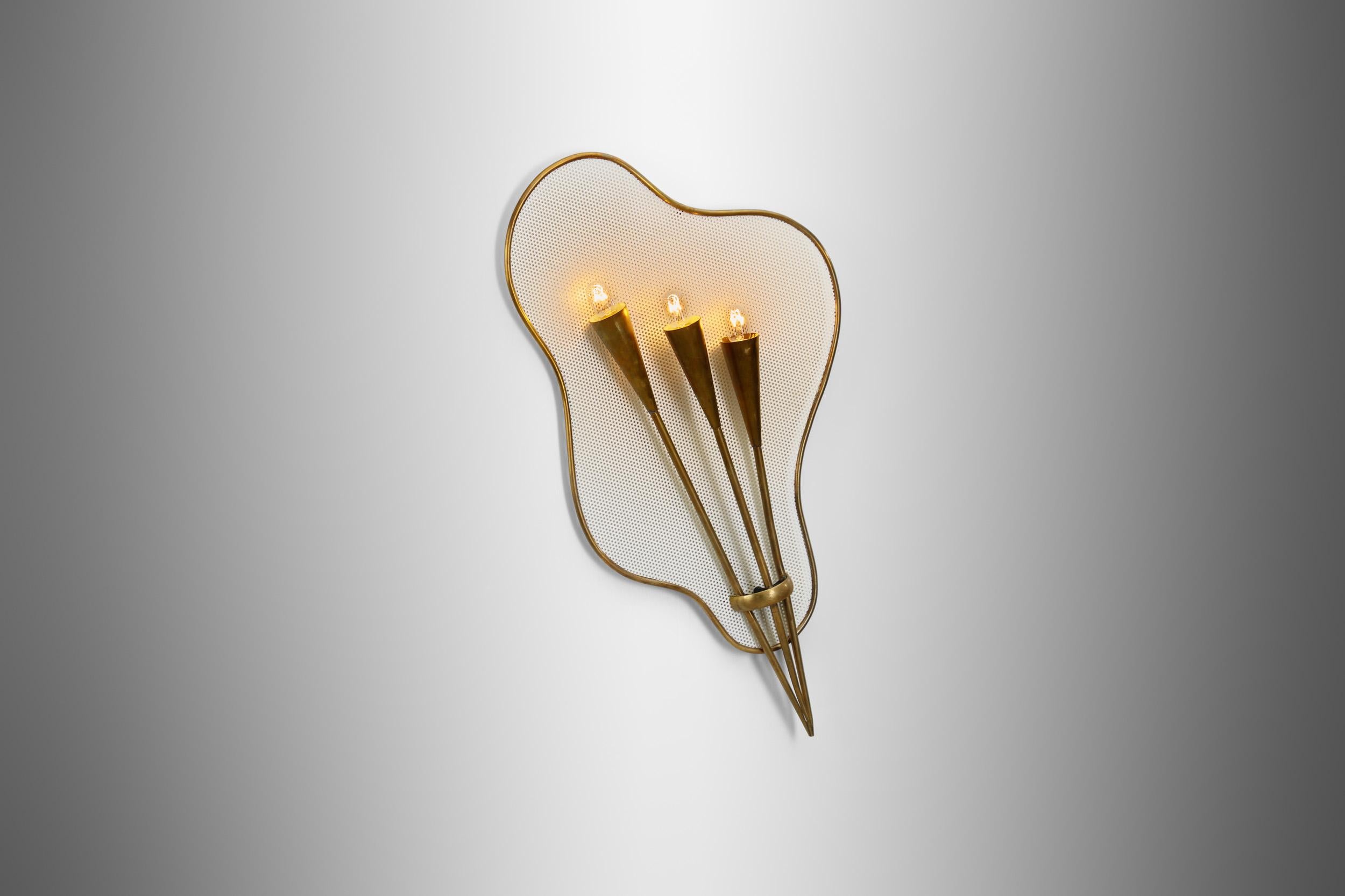 The mid-20th century brought about a revolution in design throughout Europe, where function and form merged in the most intriguing ways. One such example of this era’s creativity is this exceptionally unique wall lamp attributed to the French