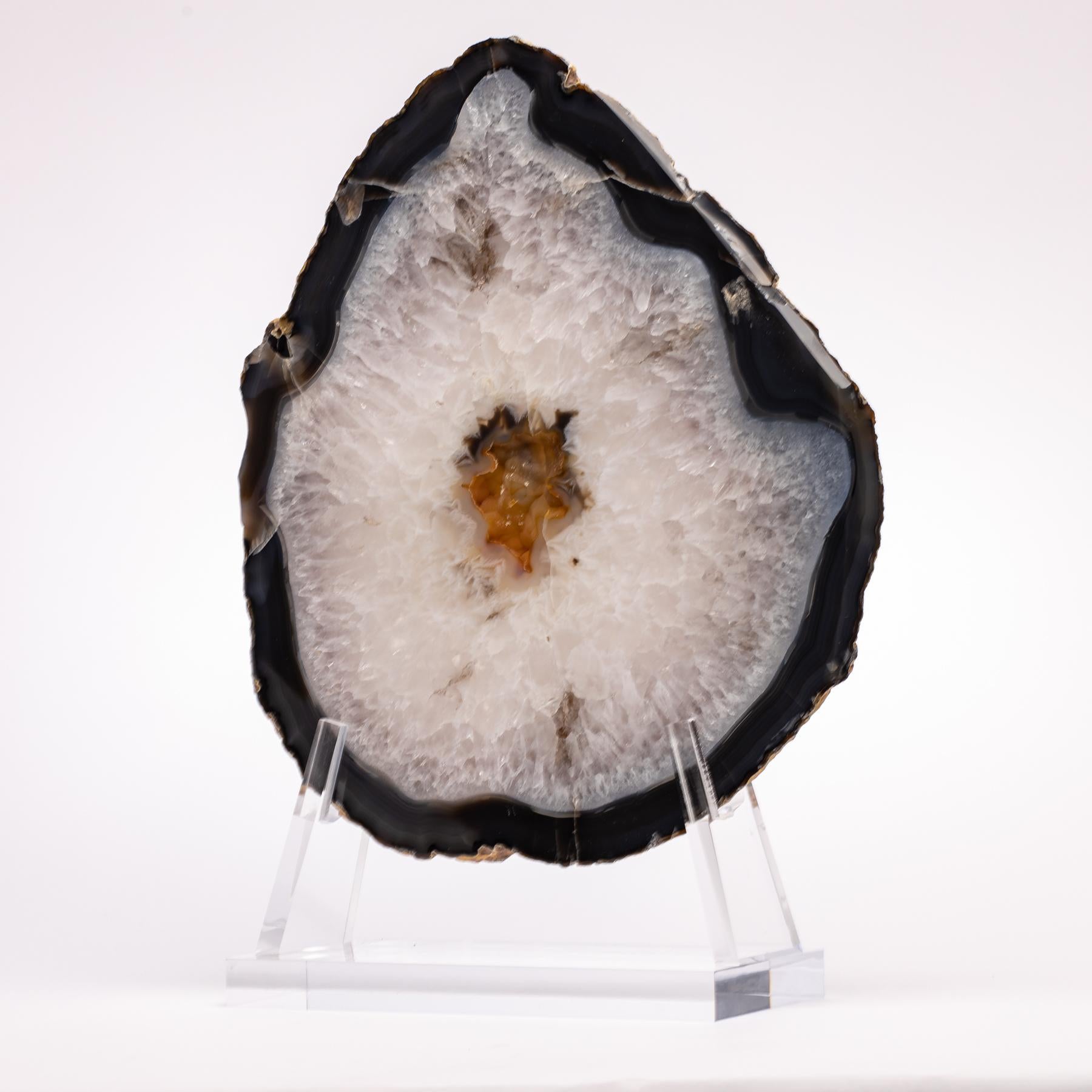 Top grade agate slab from Brazil
Agates are formed in rounded nodules, which are sliced open to bring out the internal pattern hidden in the stone. Their formation is commonly from depositions of layers of silica filling voids in volcanic vesicles