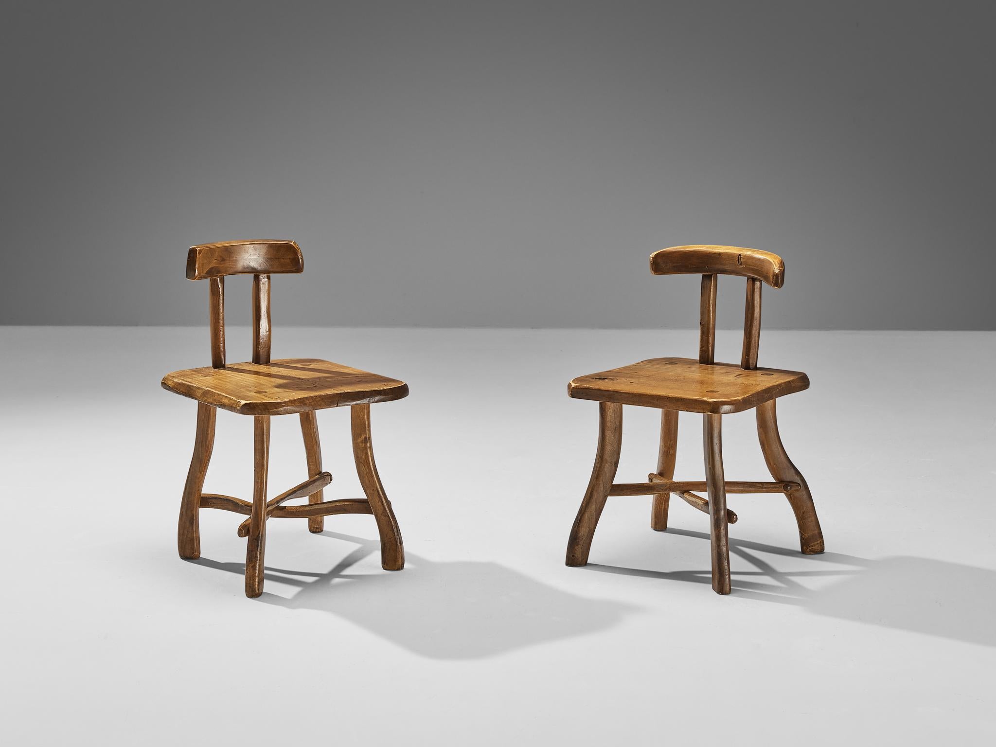 Brutalist chairs, maple, Europe 1960s 

Beautiful and naturalistic chairs made in Europe in the 1960s. The backrest of these pieces consists of a large piece of maple wood. Another slab is used for the seat. These chairs have a subtle cross-shape