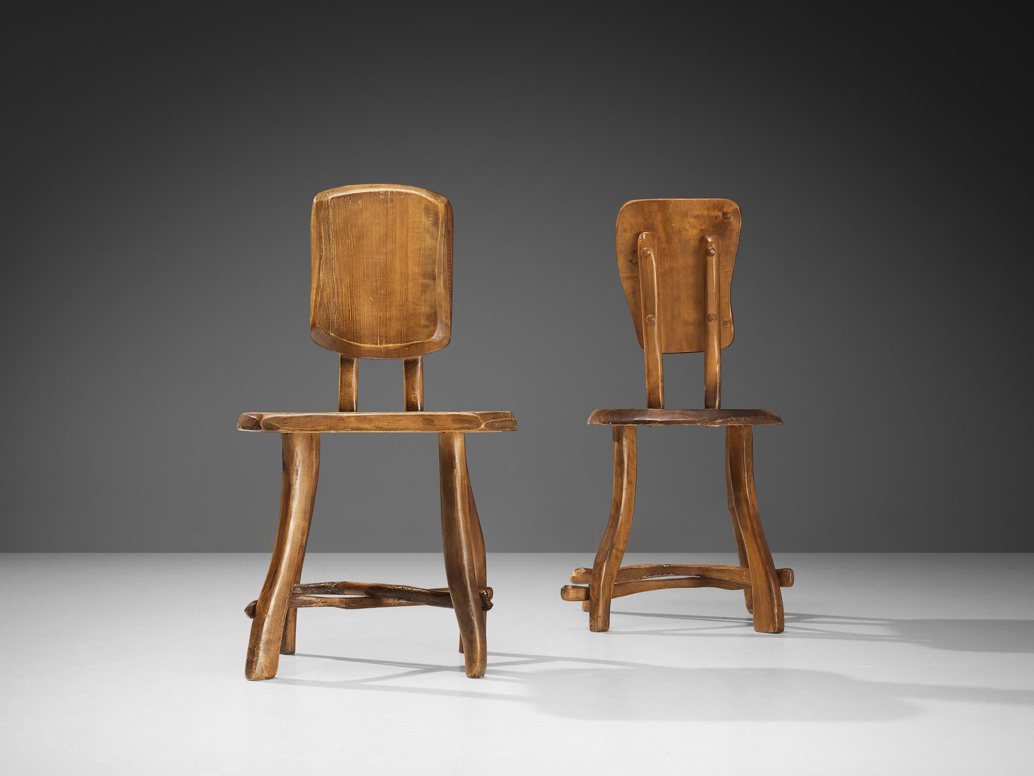 Brutalist chairs, maple, Europe 1960s 

Beautiful and naturalistic chairs made in Europe in the 1960s. The backrest of these pieces consists of a large piece of maple wood. Another slab is used for the seat. These chairs have a subtle cross-shape