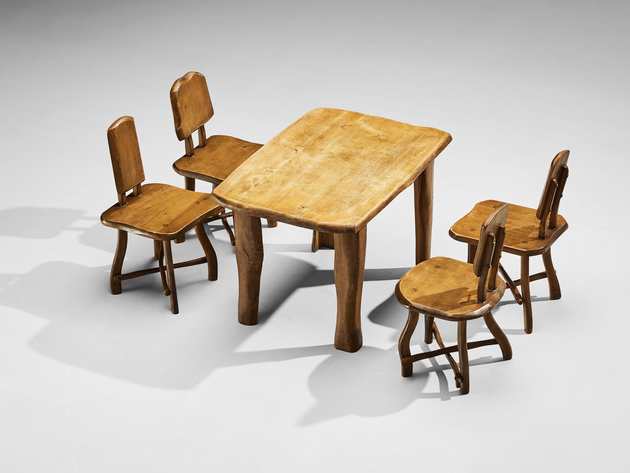 Dining room set with table and four chairs, maple, Europe 1960s 

Beautiful and naturalistic dining set consisting of a table and chairs made in Europe in the 1960s. The chair features a backrest consisting of a large piece of maple wood. Another