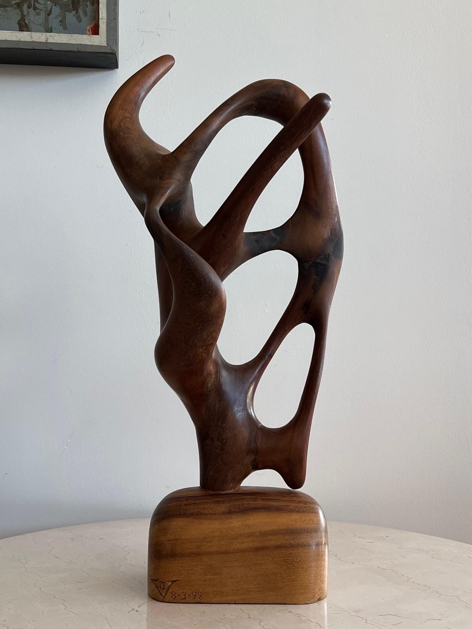 A very unusual and well done organic carved wood sculpture. Signed JEV and dated 1992.