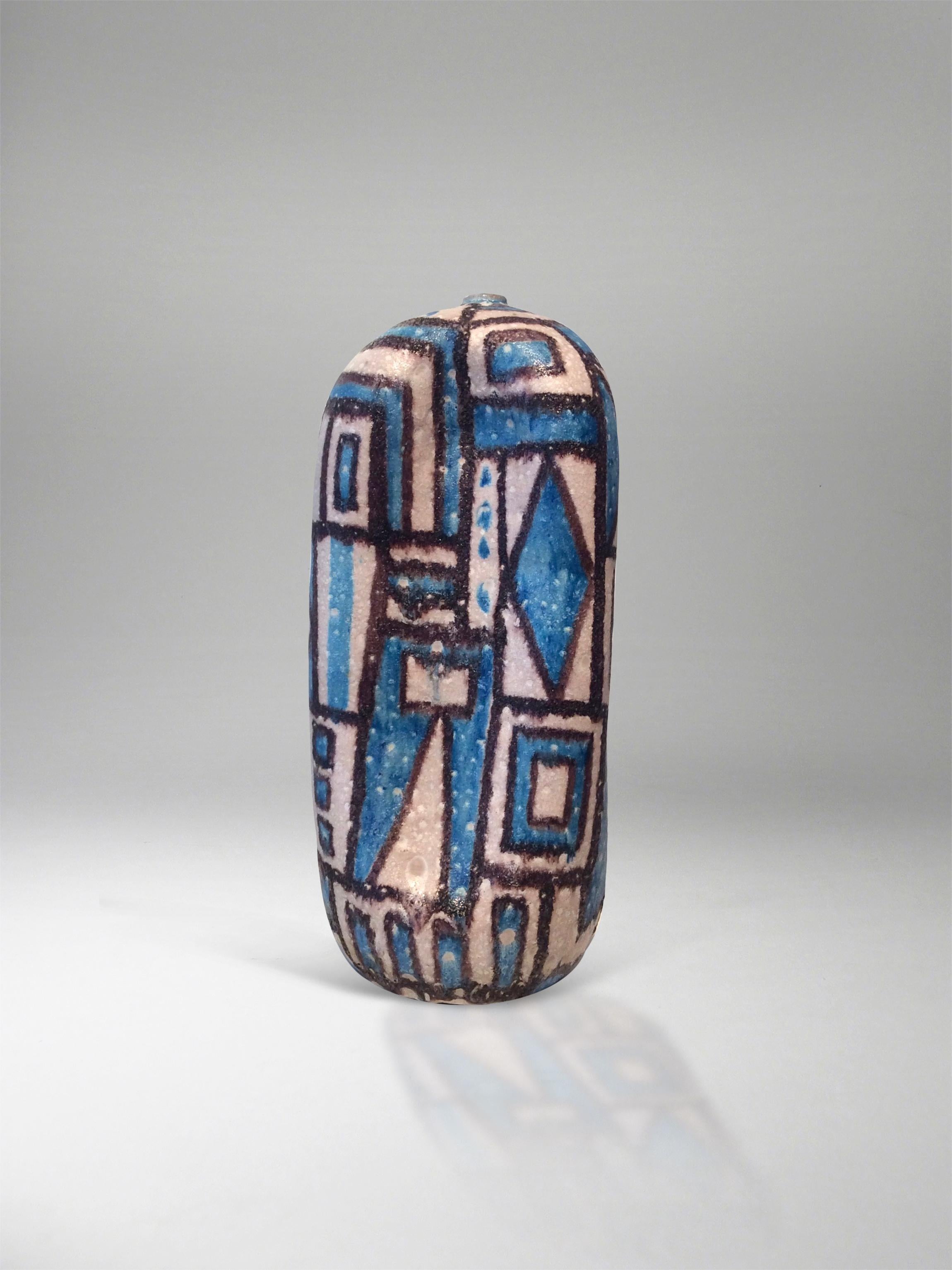 Dynamic, asymmetrical ceramic sculpture glazed in deep brown and rich blue on ivory ground with varied geometric patterns. The sculpture has a narrow neck with small lip and the base has a small hole (which is glazed and so forms part of the