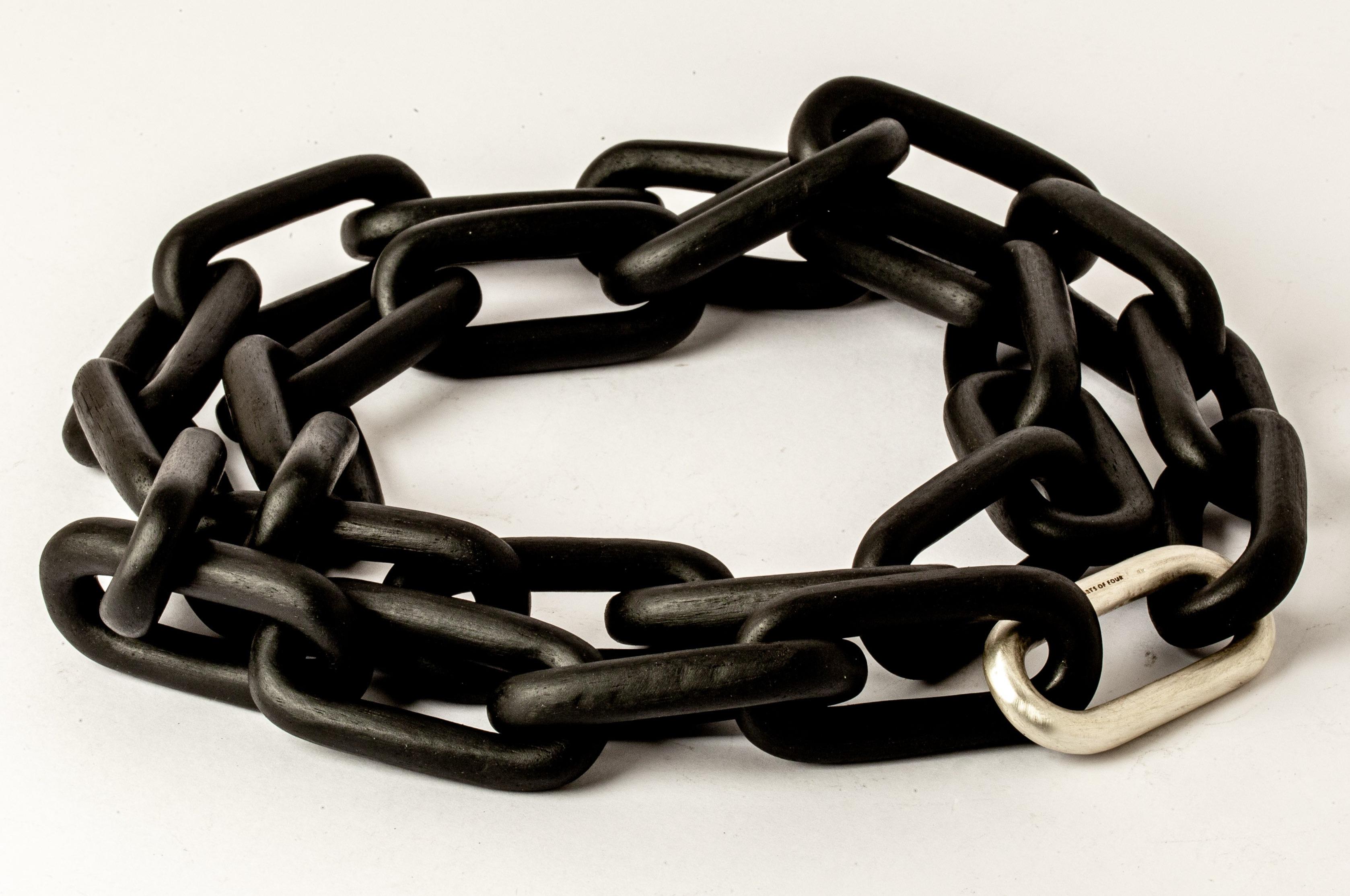 Chain necklace made of sterlings silver and wood. All organic chain is carved by hand. In the case of the chains made of wood, they are absolutely seamless; carved from a single long slab of wood (see link). 
The Charm System is an interrelated