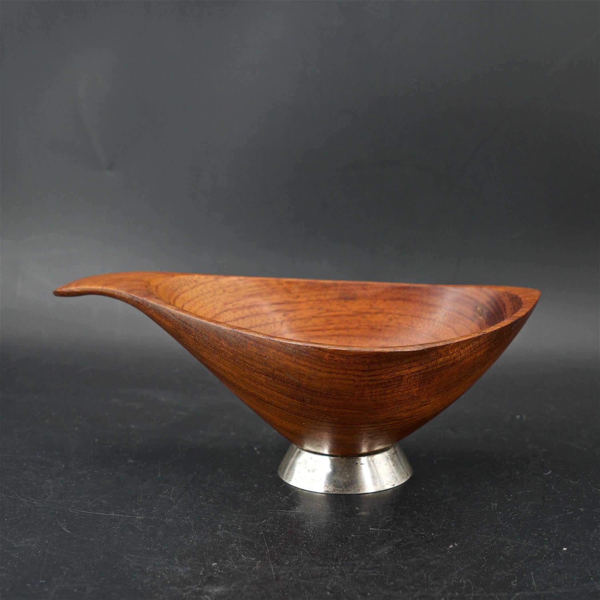 Uncommon form, rarely seem with the sterling base. Etched; BUBINGA Emilan, and with penci; 61.
 