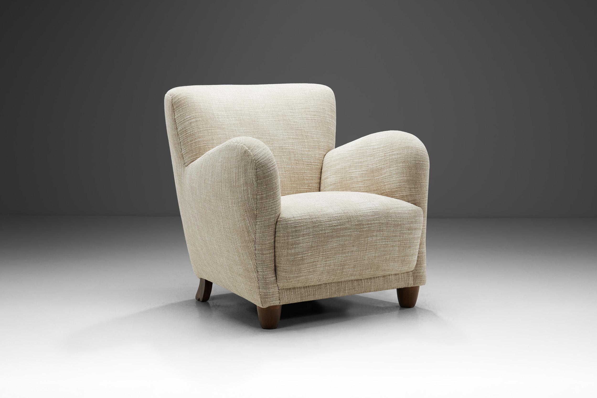 This early Danish mid-century armchair is a great example of the unification of comfort and delicate design elements. The touch of Danish Modernism is recognizable in the exquisite materials, the craftsmanship, and in the elegantly curved and