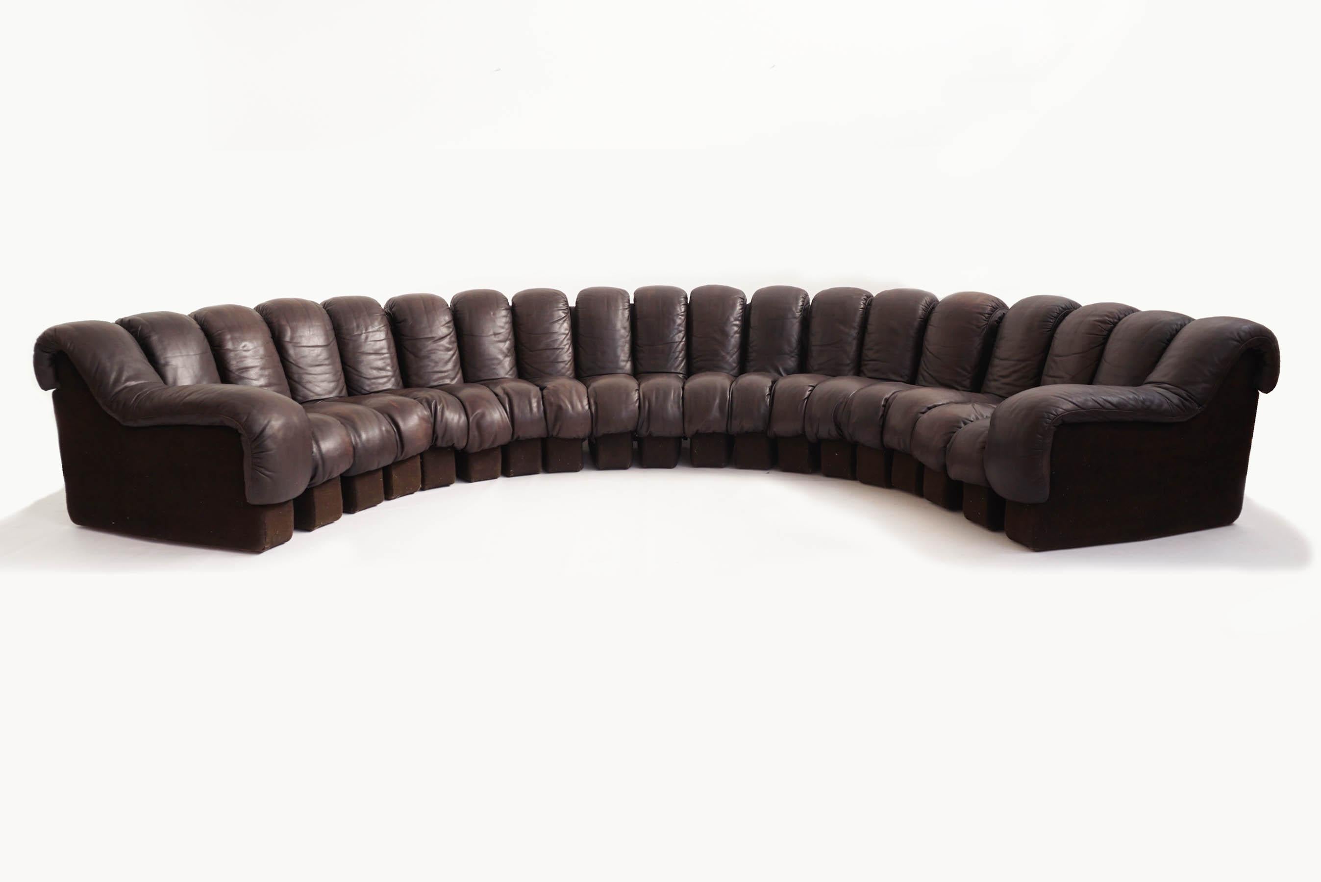 19 Pieces for this super beautiful adjustable in the posizion and size you like organic sofa produced by De Sede, 1970 Switzerland

Deep brown patina leather, wool, 19 modular element.
Each element is 25 x 100 x seating HT. 35 cm
total HT. 70