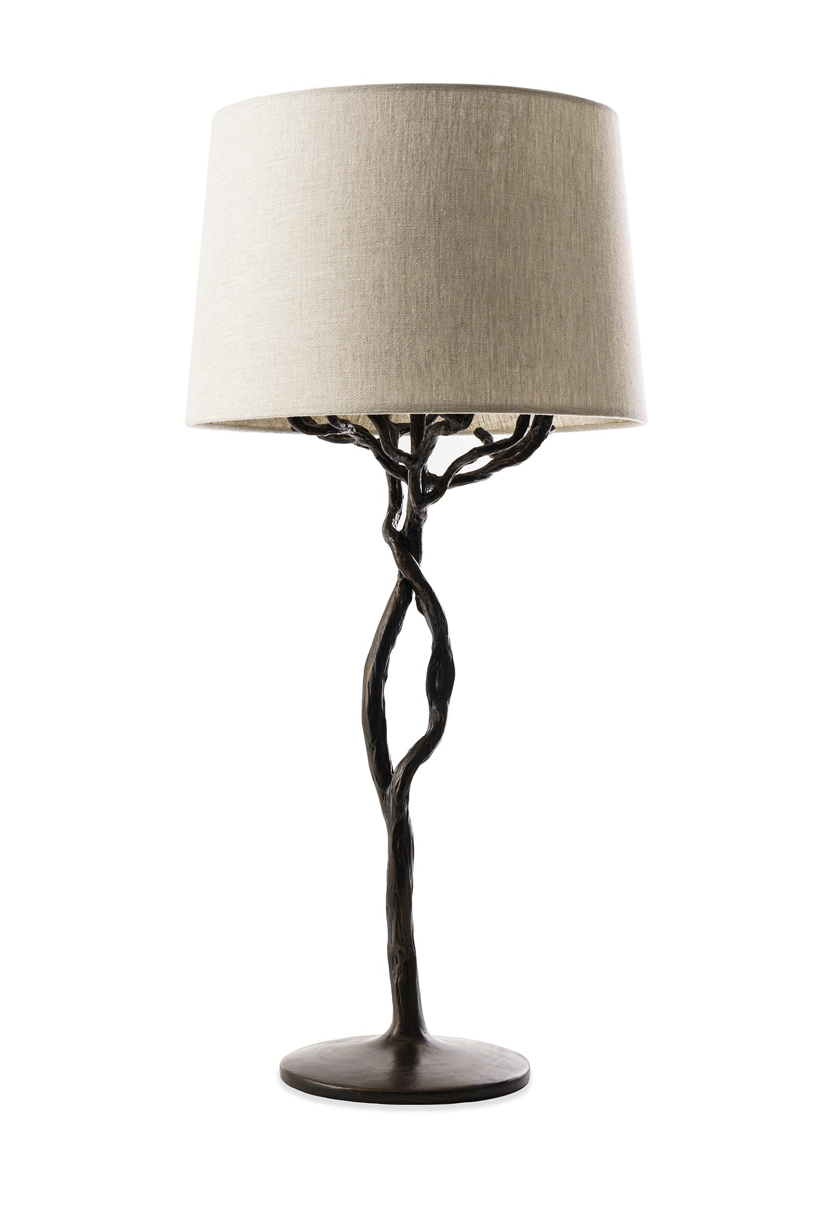 The Etna tree branch table lamp is individually hammered and hand formed. Each piece has been skillfully finished in plaster to resemble the texture of tree bark and is a unique organic sculpture. Available in Antique Gold and Bronze Plaster Finish.