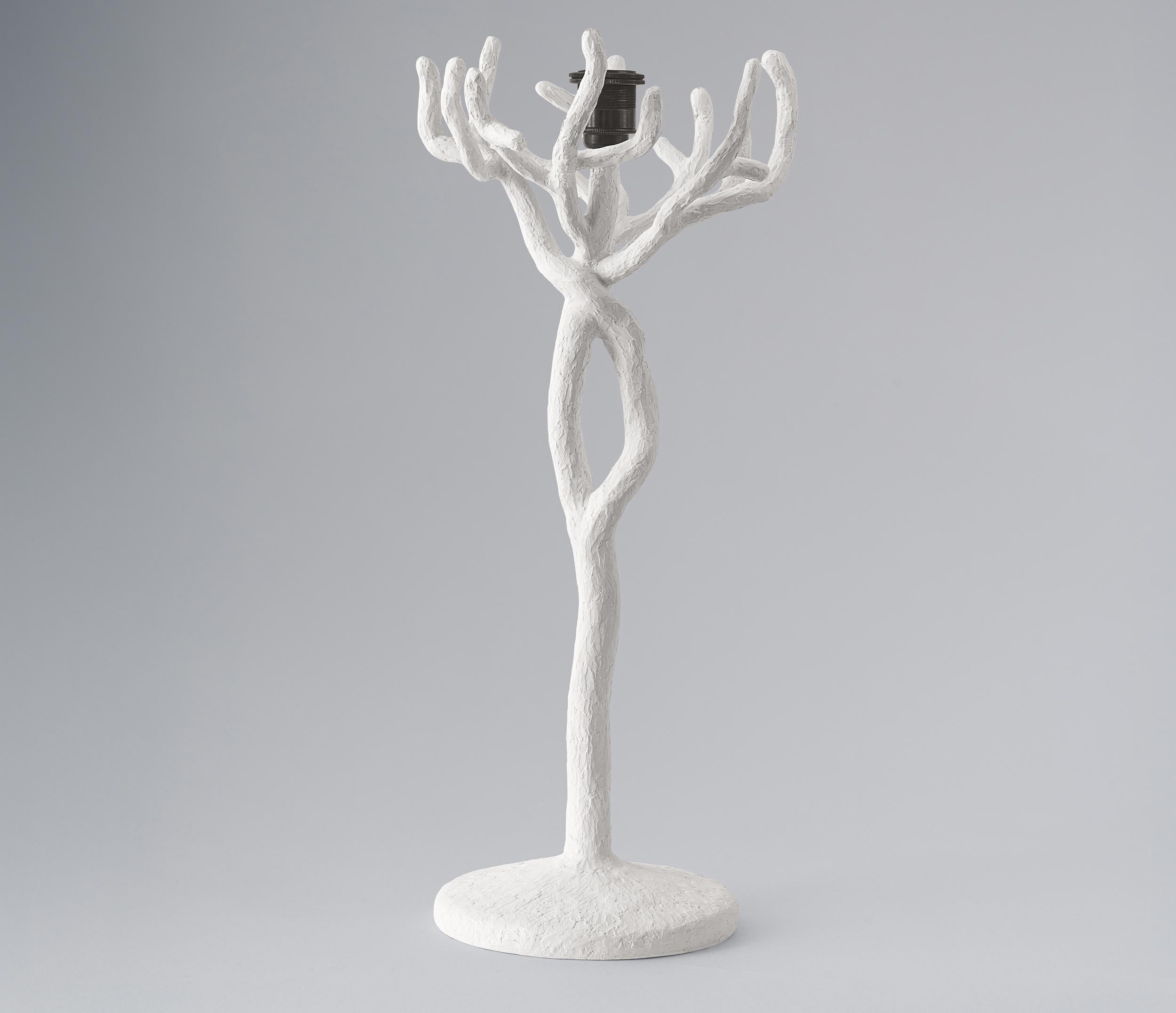 The Etna tree branch table  lamp is individually hammered and hand formed. Each piece has been skillfully finished in plaster to resemble the texture of tree bark. Available in Bronze Plaster Finish and White Plaster. This lamp is not just a source