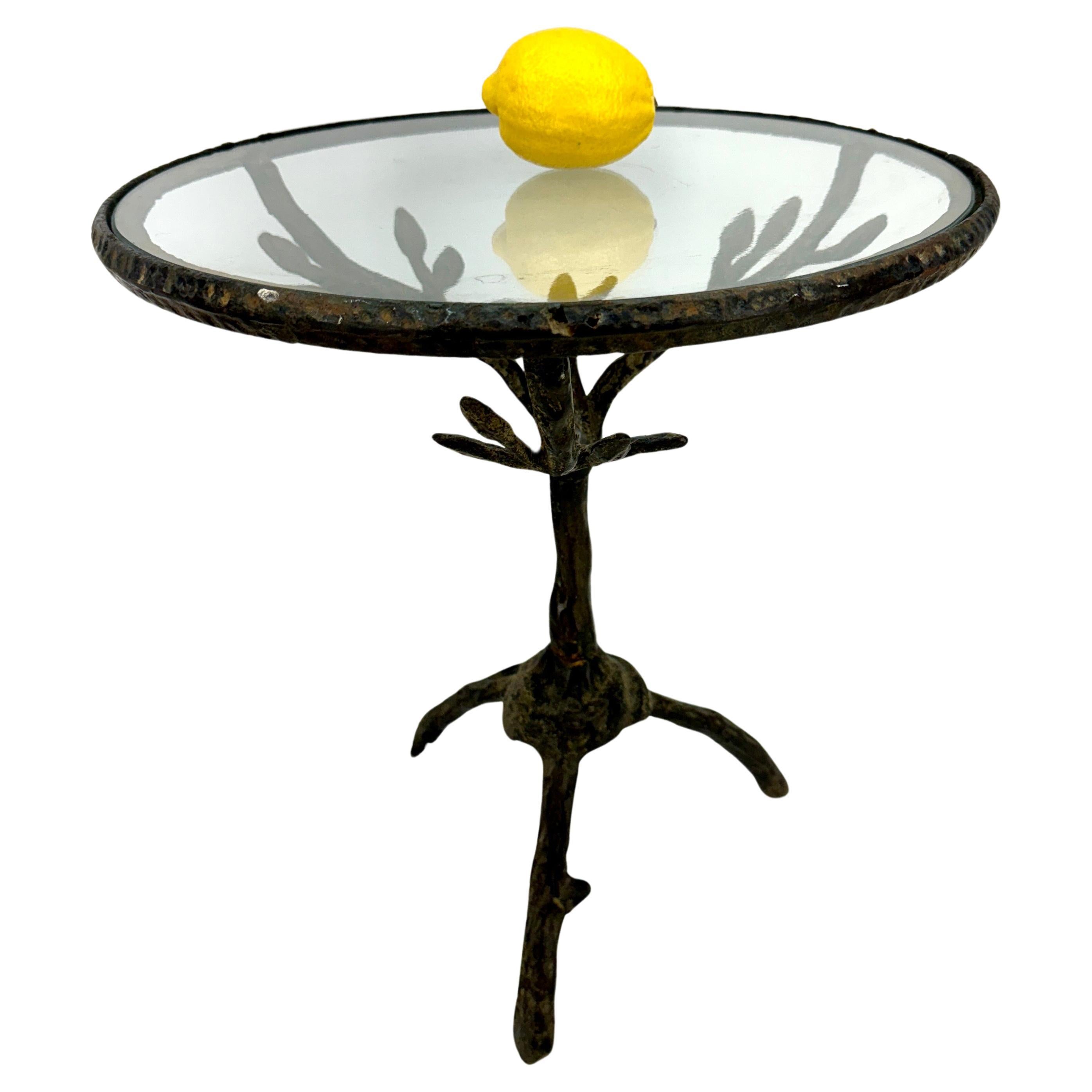  Cast Iron Accent Side Table with Round Glass Top

Unique Mid-Century hand-crafted metal table with branches and bird, perfect used formally or informally. This eye-catching, versatile table will certainly be a conversation piece wherever placed