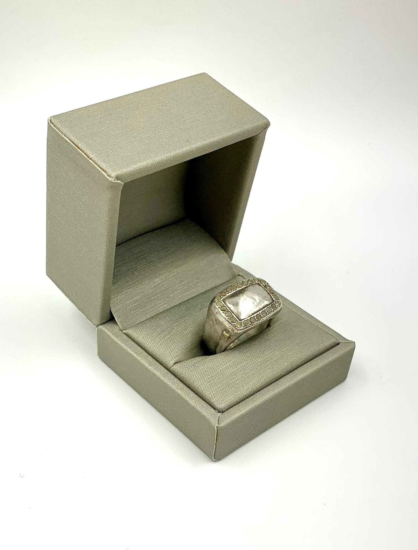 Hand hammered silver signet ring with a crown of rose cut icy yellow diamonds by Lebanese designer Rosa Maria
Provenance: estate sourced from the collection of a noted NYC psychiatrist and jewelry collector.
Marks: Rosa Maria, 925 for Sterling