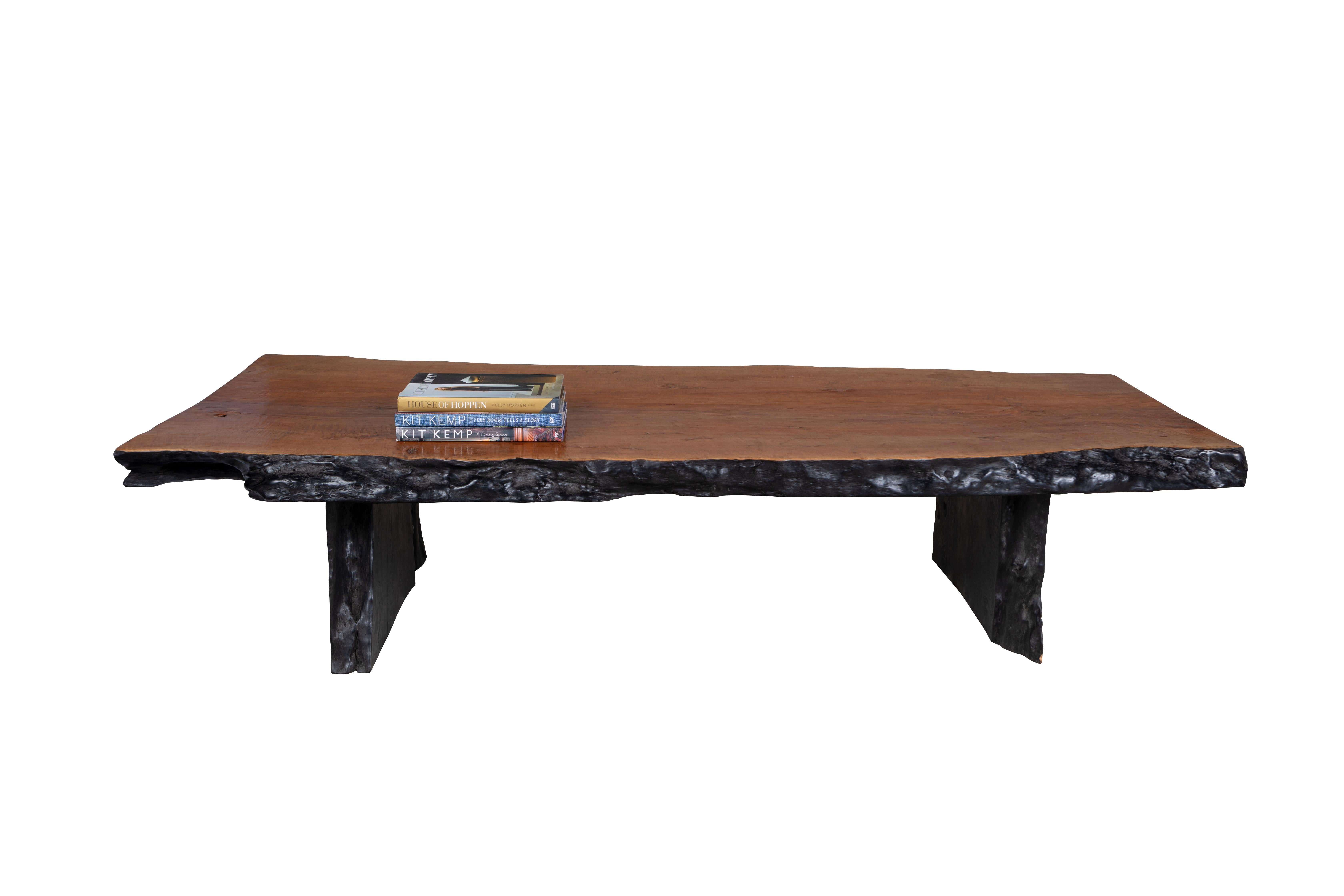 This coffee table is built from one single piece of lychee hardwood. The top is flattened, sanded, and then stained to compliment the wood's naturally rich texture and rustic patterns. The sides are kept in their natural organic shape and then