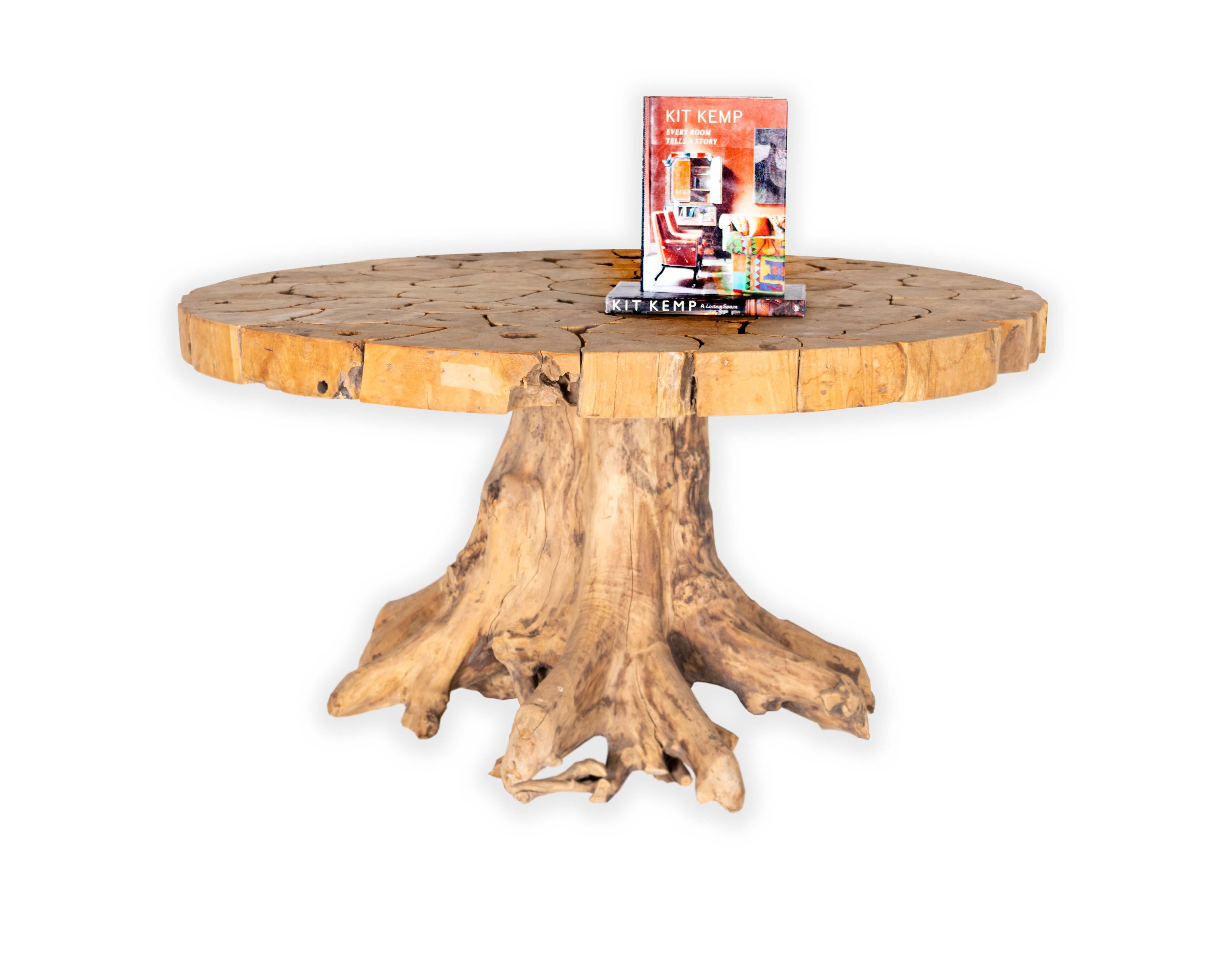 Organic form teak dining table with teak slice top.

This item is crafted from natural materials. Coloring and detailing may vary, adding to its uniqueness.

Item from our one of a kind collection, Le Monde, exclusive to Brendan