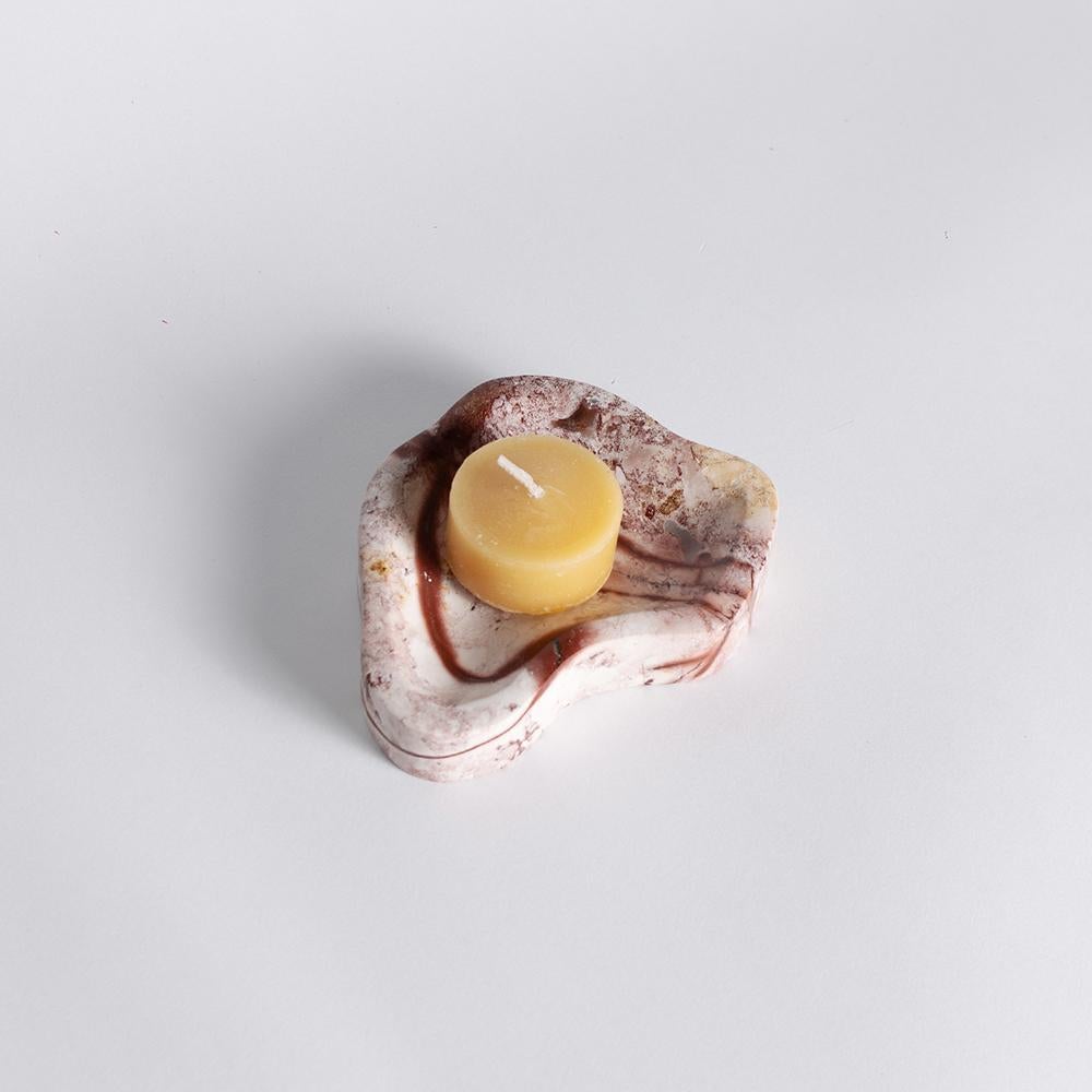 Crafted from organic Andean stone, this is the perfect catchall for holding small essentials. Calming and organic, this contemporary dish is a great addition to any tabletop.

This sweet dish adds a drop of the Andes to a small space. This Andean