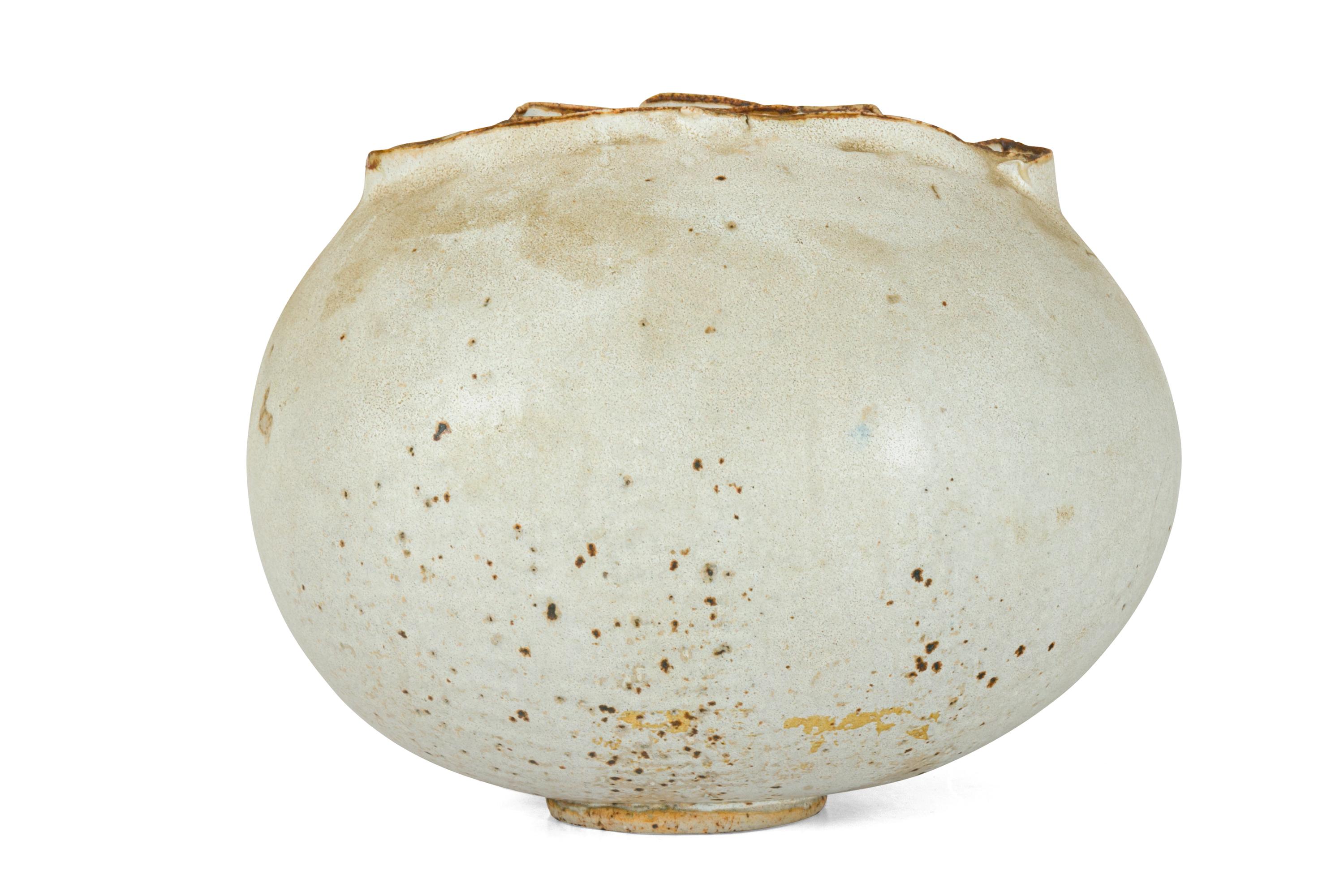 A fascinating example of studio pottery. The pod like form has a wonderfully heavy glaze creating an almost volcanic effect. There is a mark on the bottom that I couldn't make out but clearly a talented potter.