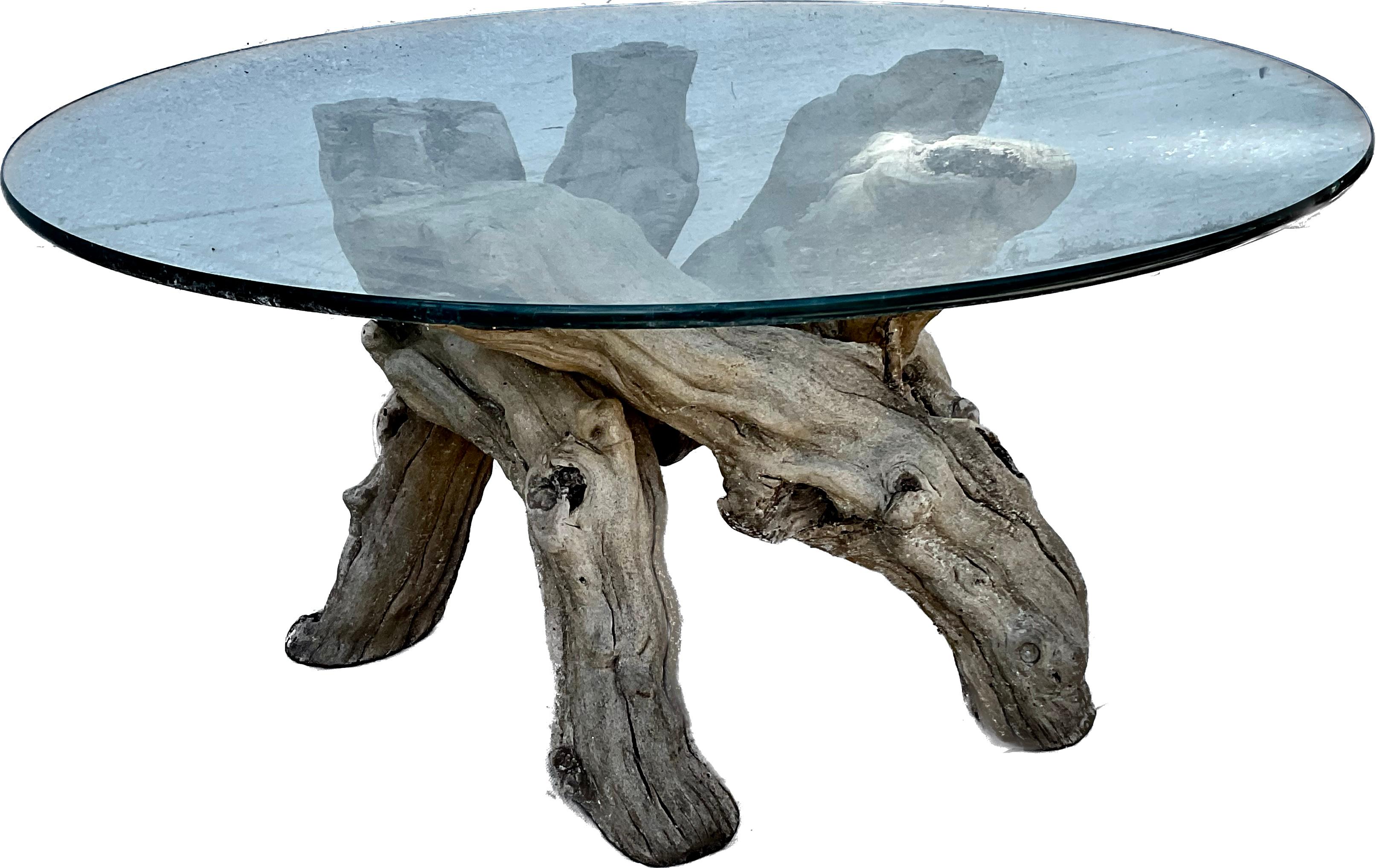 Beautiful vintage organic modern form grape vine base coffee table with circular glass top. Unique design of roots allow top to sit evenly while maintaining the natural look. 