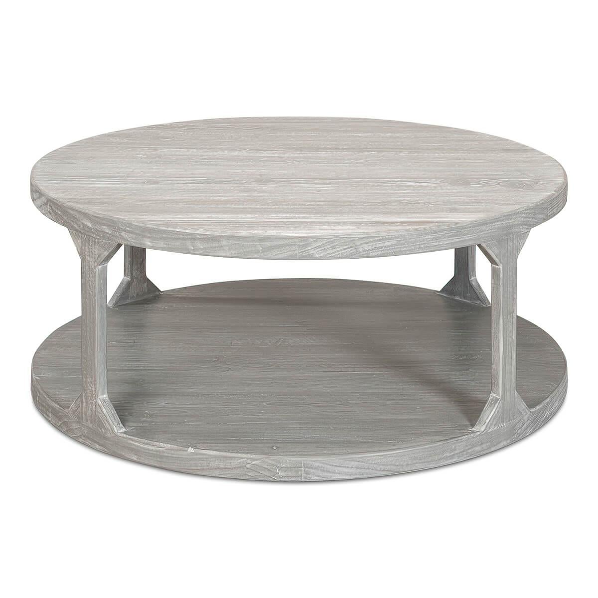 Organic modern round coffee table, the two-tier table finished in a greyed over pine.

Dimensions: 45