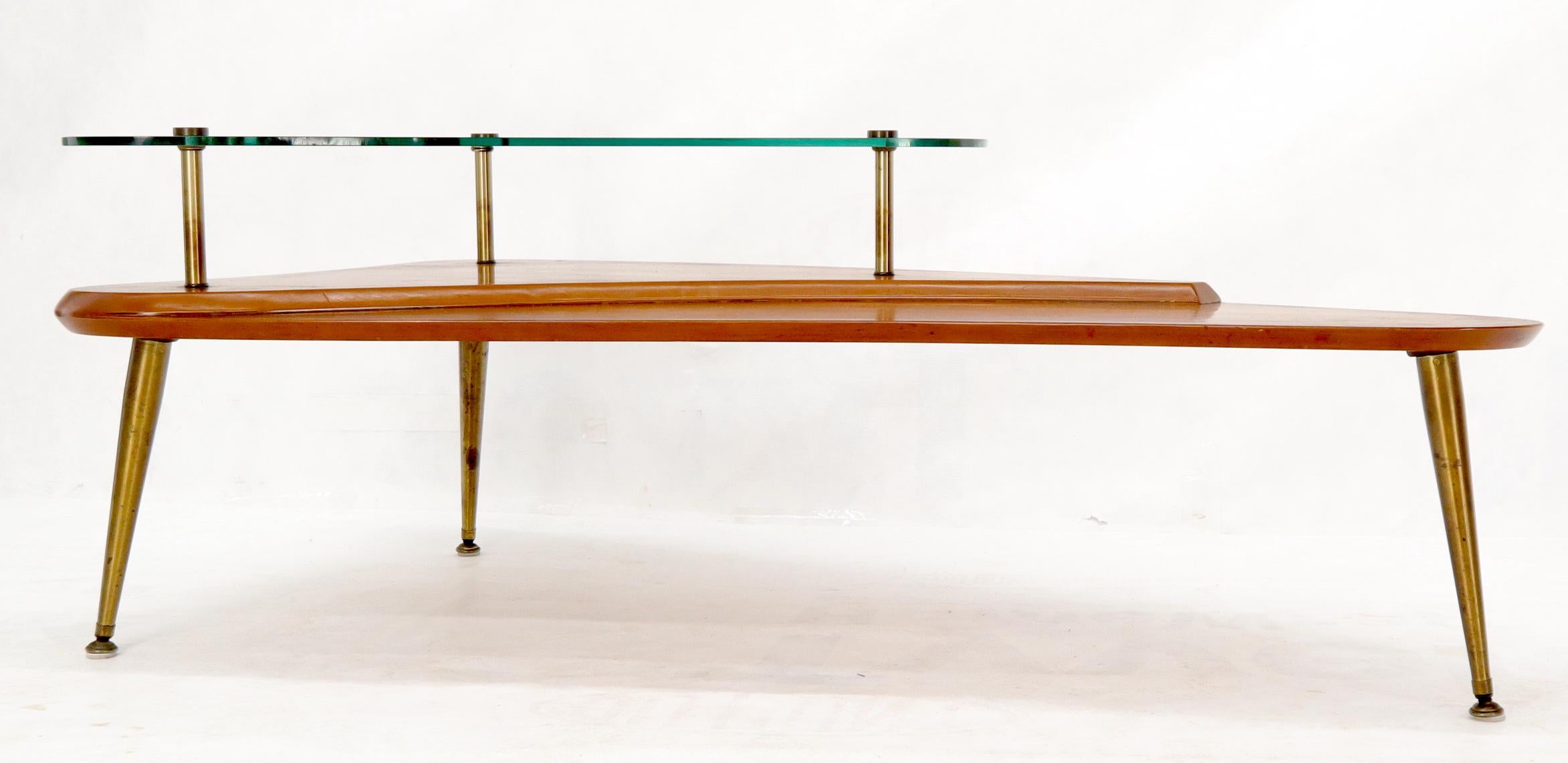 Mid-Century Modern unusual irregular boomerang shape coffee side table on tapered brass legs.