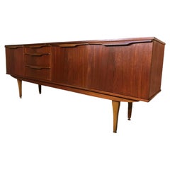 organic large teak Vintage sideboard featuring beautifully sculpted wave handles